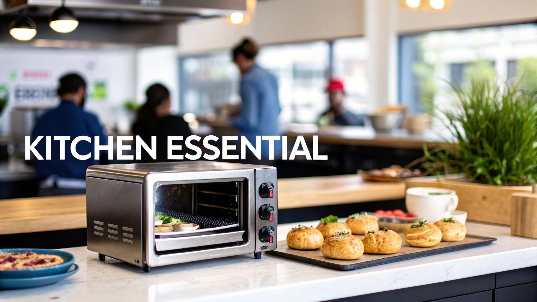 A sleek stainless steel countertop convection oven bakes food in a modern kitchen with fresh pastries on display.