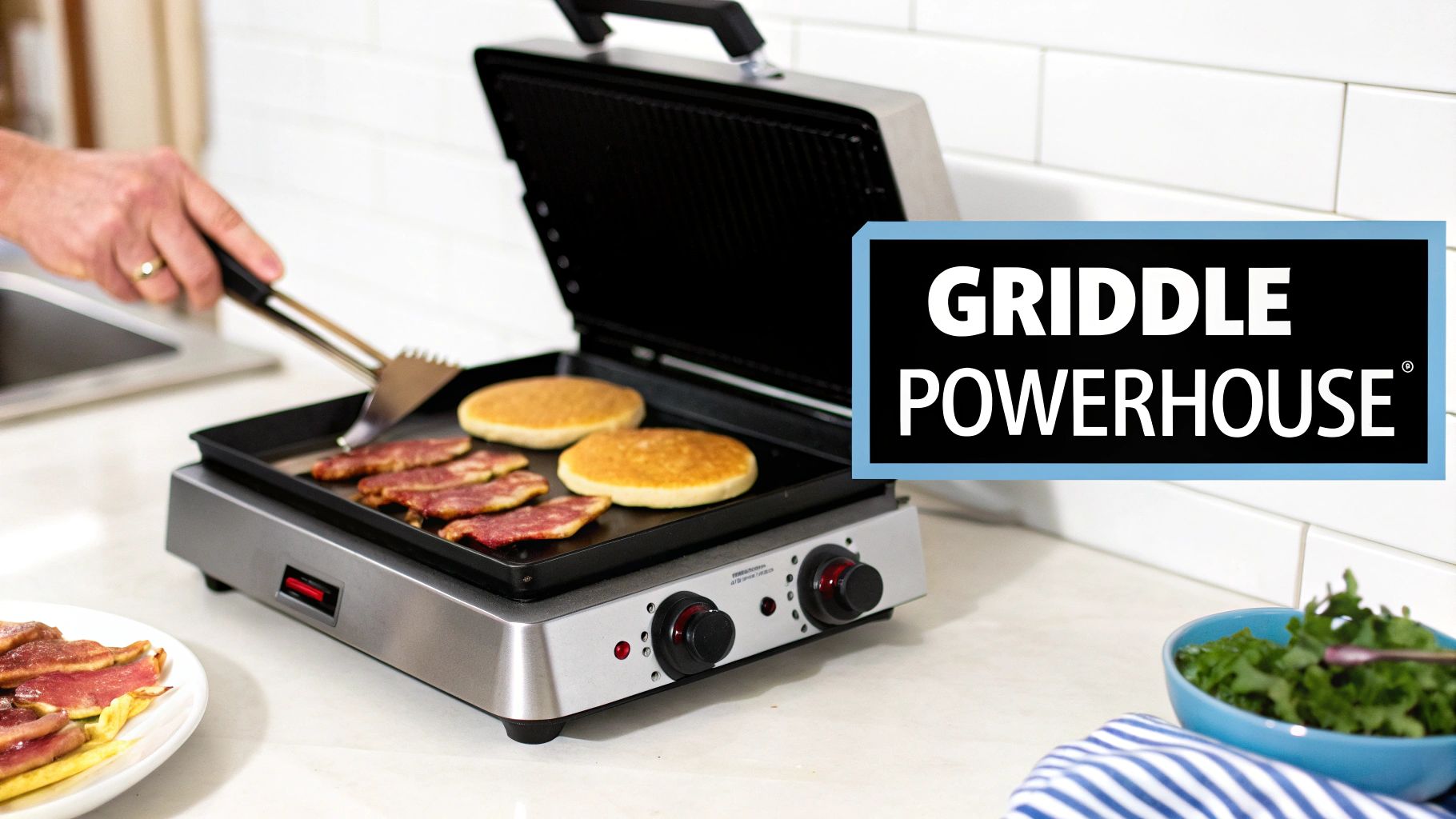 A chef cooking burgers and onions on a large commercial tabletop griddle.