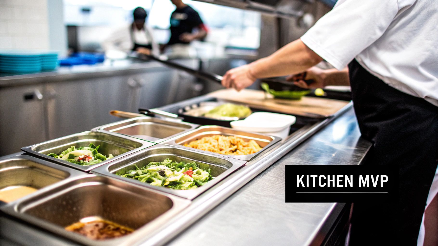 Chef preparing food on a counter with multiple stainless steel food pans filled with fresh salads and dishes.