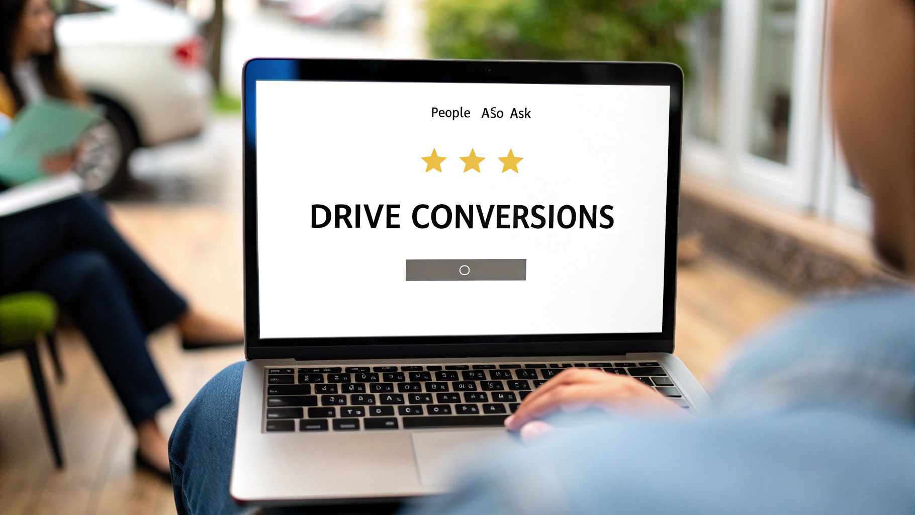A person types on a laptop displaying 'DRIVE CONVERSIONS' and 'People Also Ask' with three stars, likely a SERP feature.