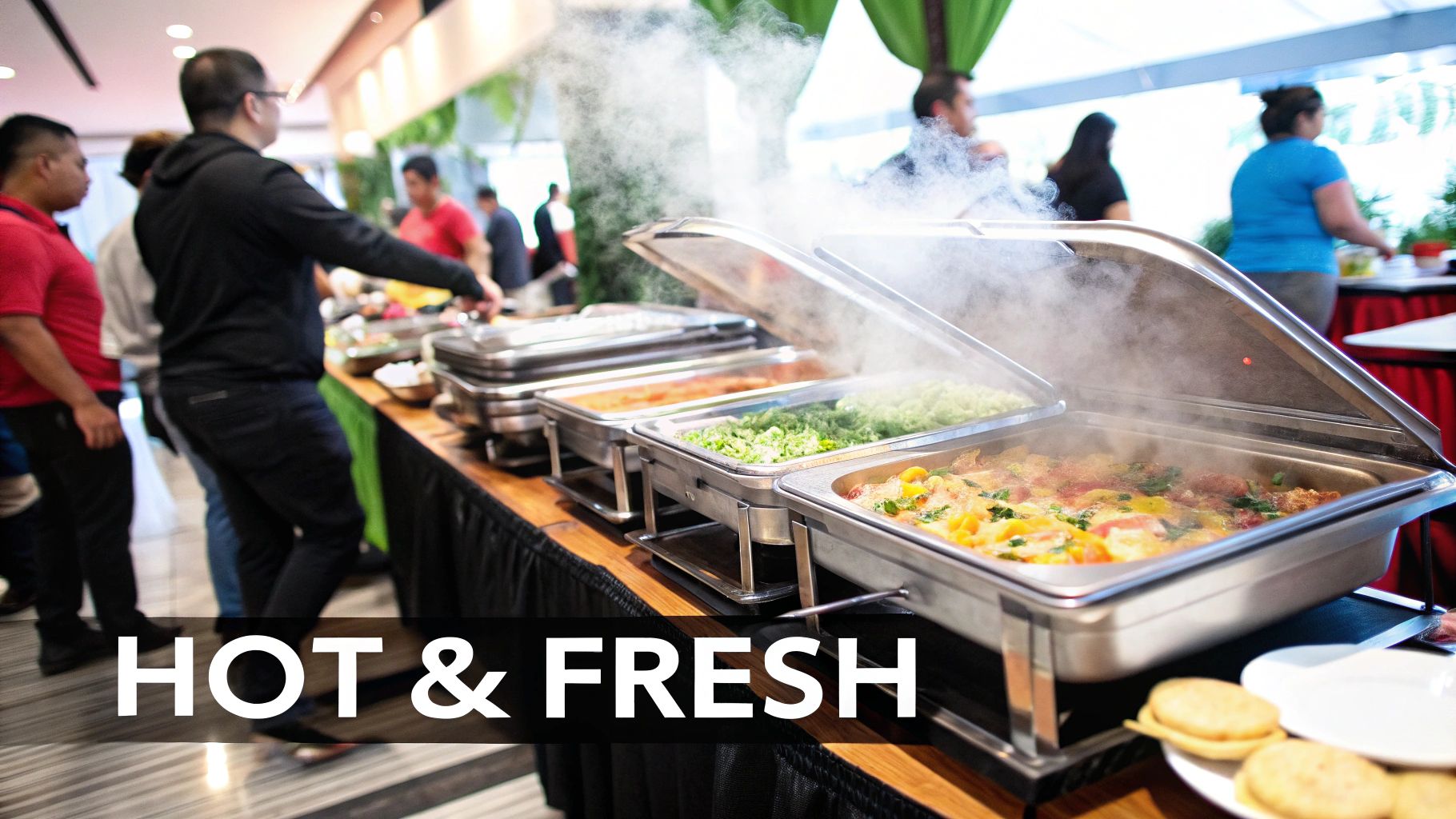 A selection of stainless steel food warmer pans filled with various dishes on a buffet line