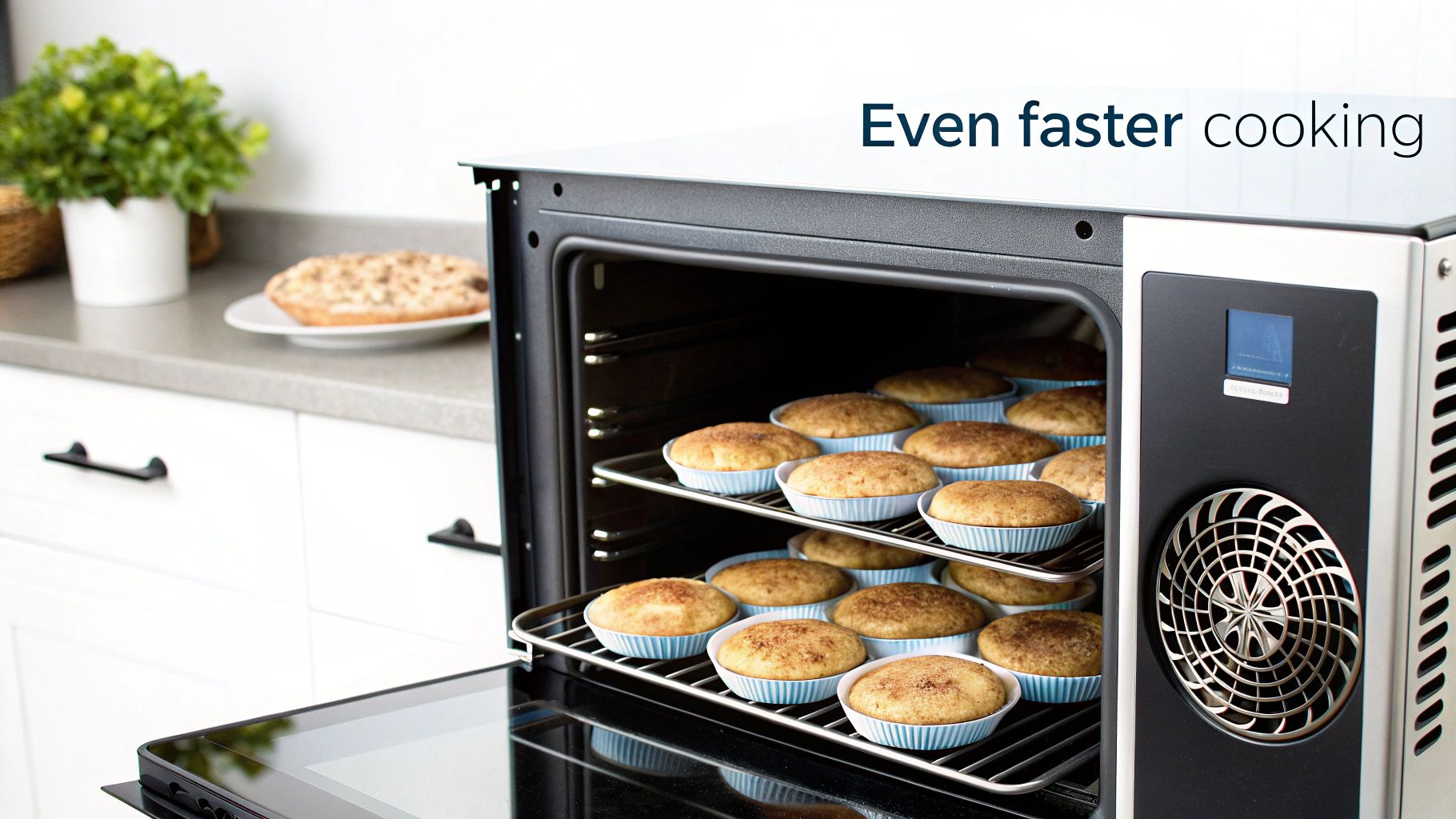 An open commercial convection oven filled with two racks of freshly baked muffins in a modern kitchen.