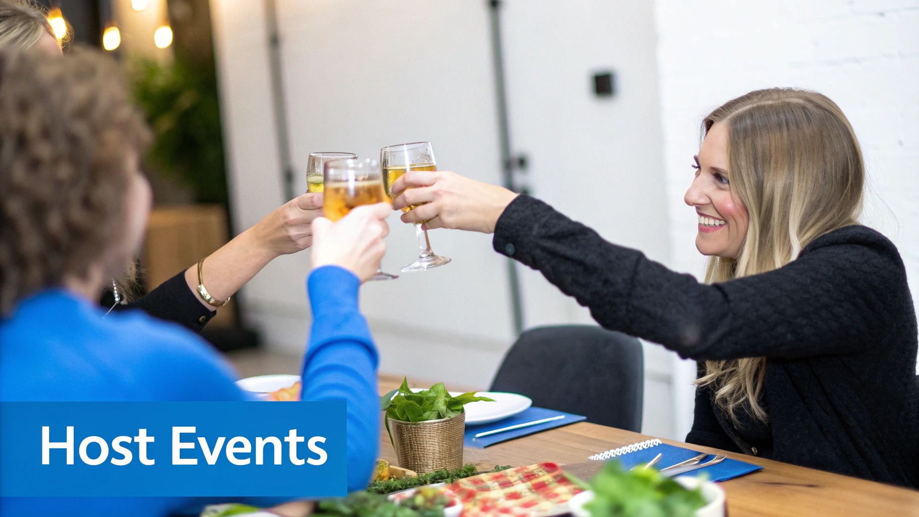 Three women cheerfully toast with glasses of sparkling wine at a social event.