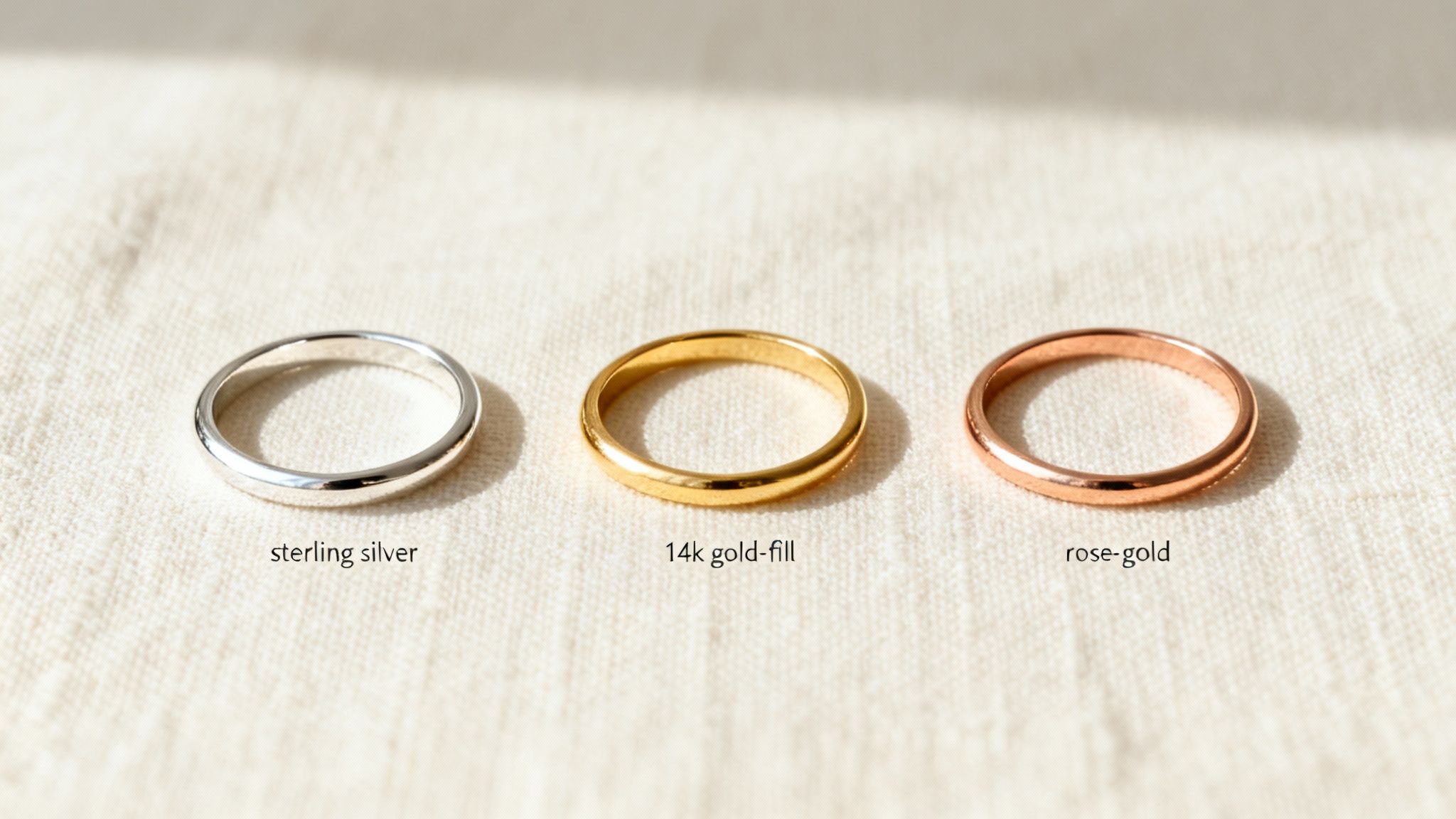 Three simple band rings showing different materials: sterling silver, 14k gold-fill, and rose-gold.