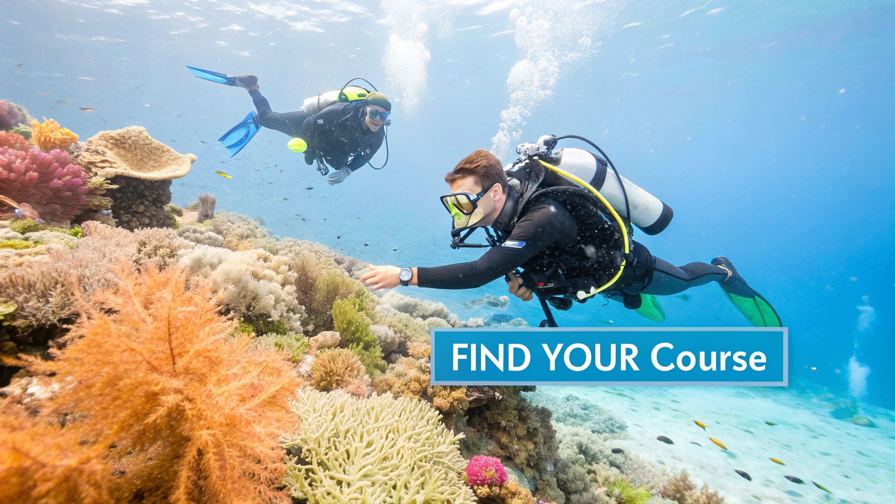 A newly certified diver gives an 'okay' sign underwater, surrounded by coral and fish.