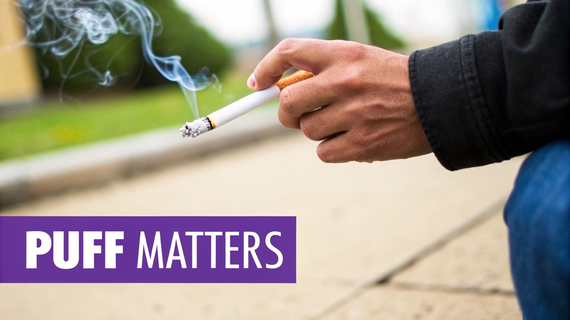 A person lighting a cigarette, with the focus on their hands and the flame.