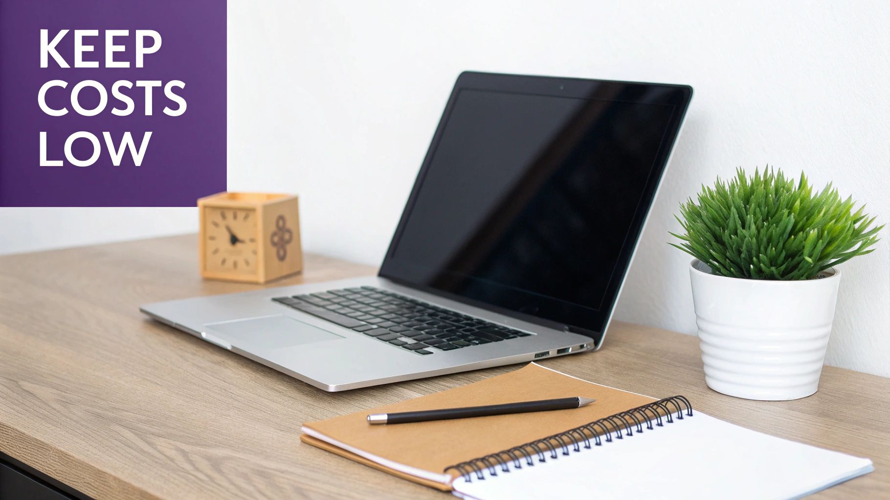 An entrepreneur working on a laptop in a modern co-working space, saving on office costs