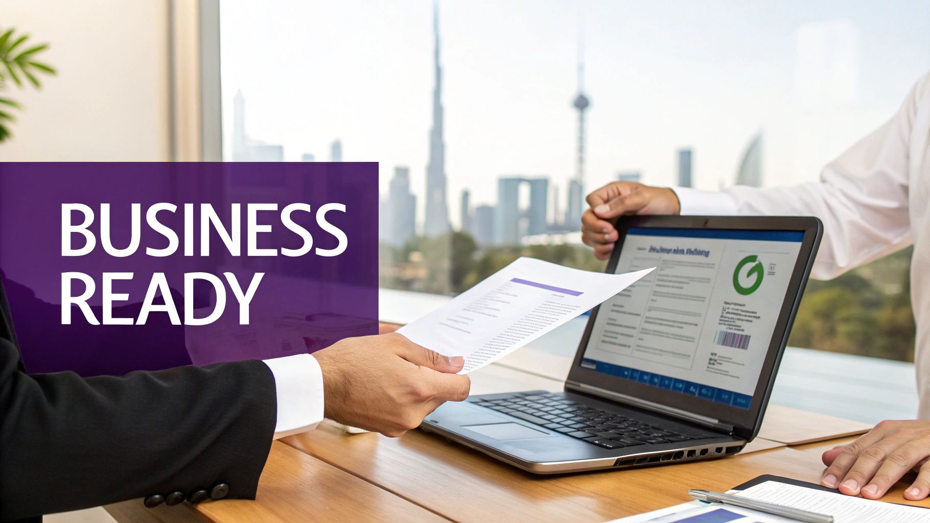 Business professionals collaborate on documents and laptop, with 'BUSINESS READY' text and iconic Dubai skyline.