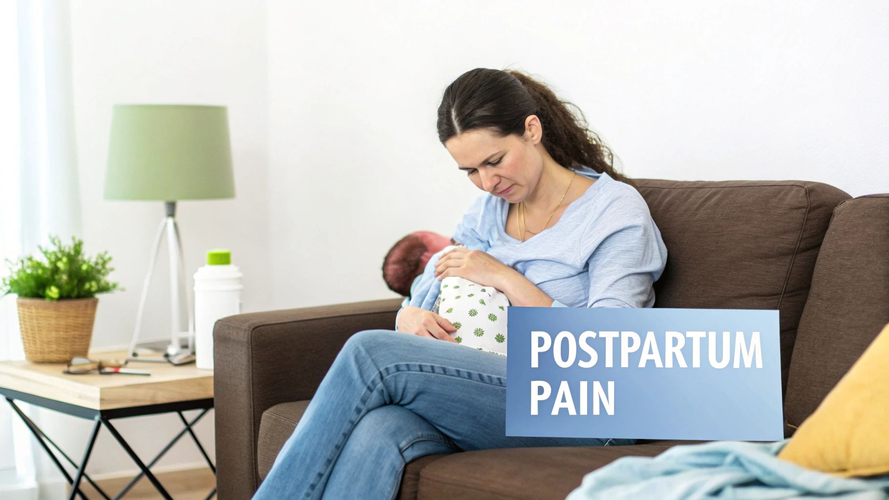 A new mother breastfeeding her baby on a couch, with a text overlay 'POSTPARTUM PAIN'.