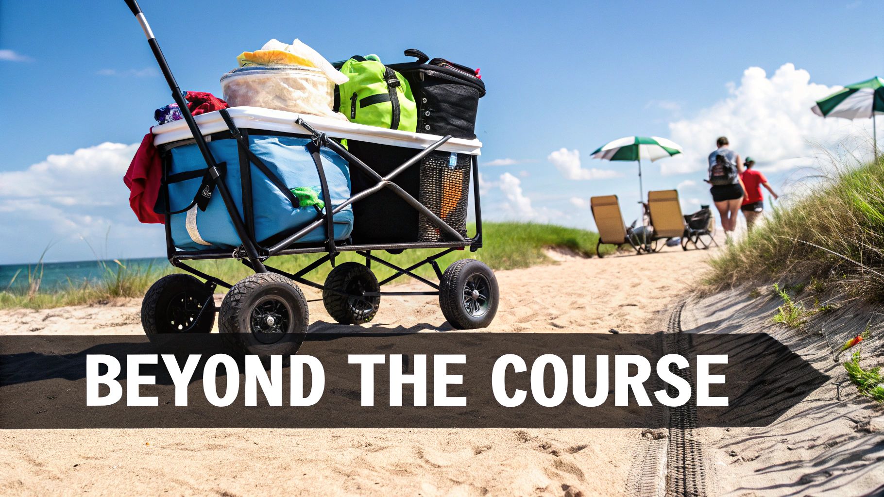 An all-terrain cart packed with beach essentials on a sandy path, heading to the ocean.