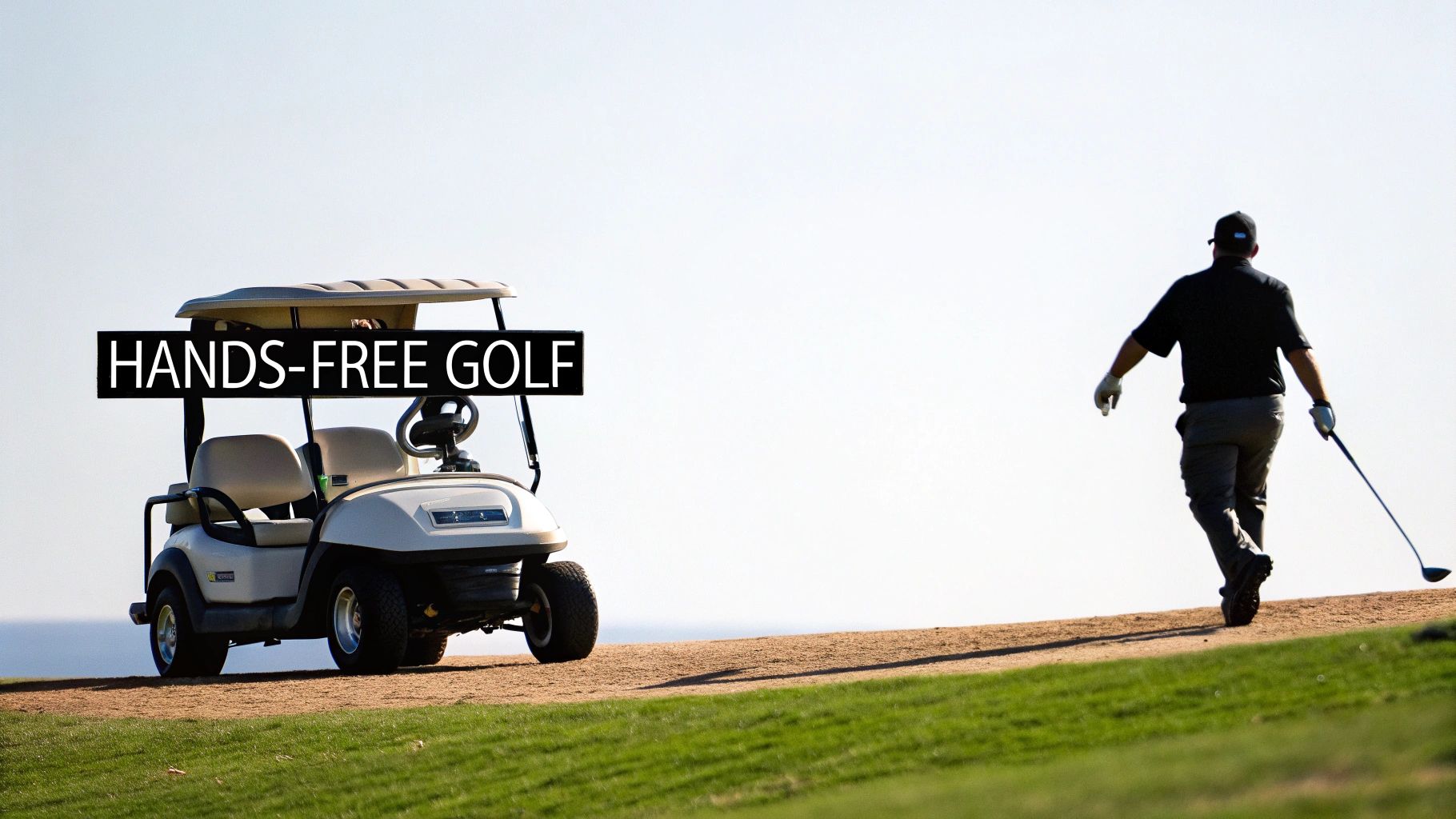 A golfer walks down the fairway with a Stewart golf cart following closely behind
