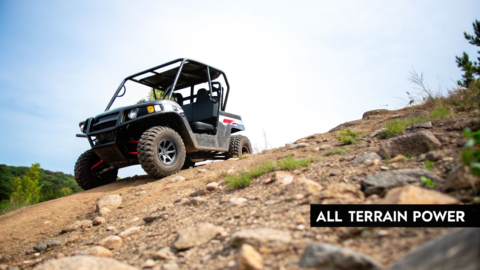 An all terrain golf cart navigating a rugged, unpaved path with ease.