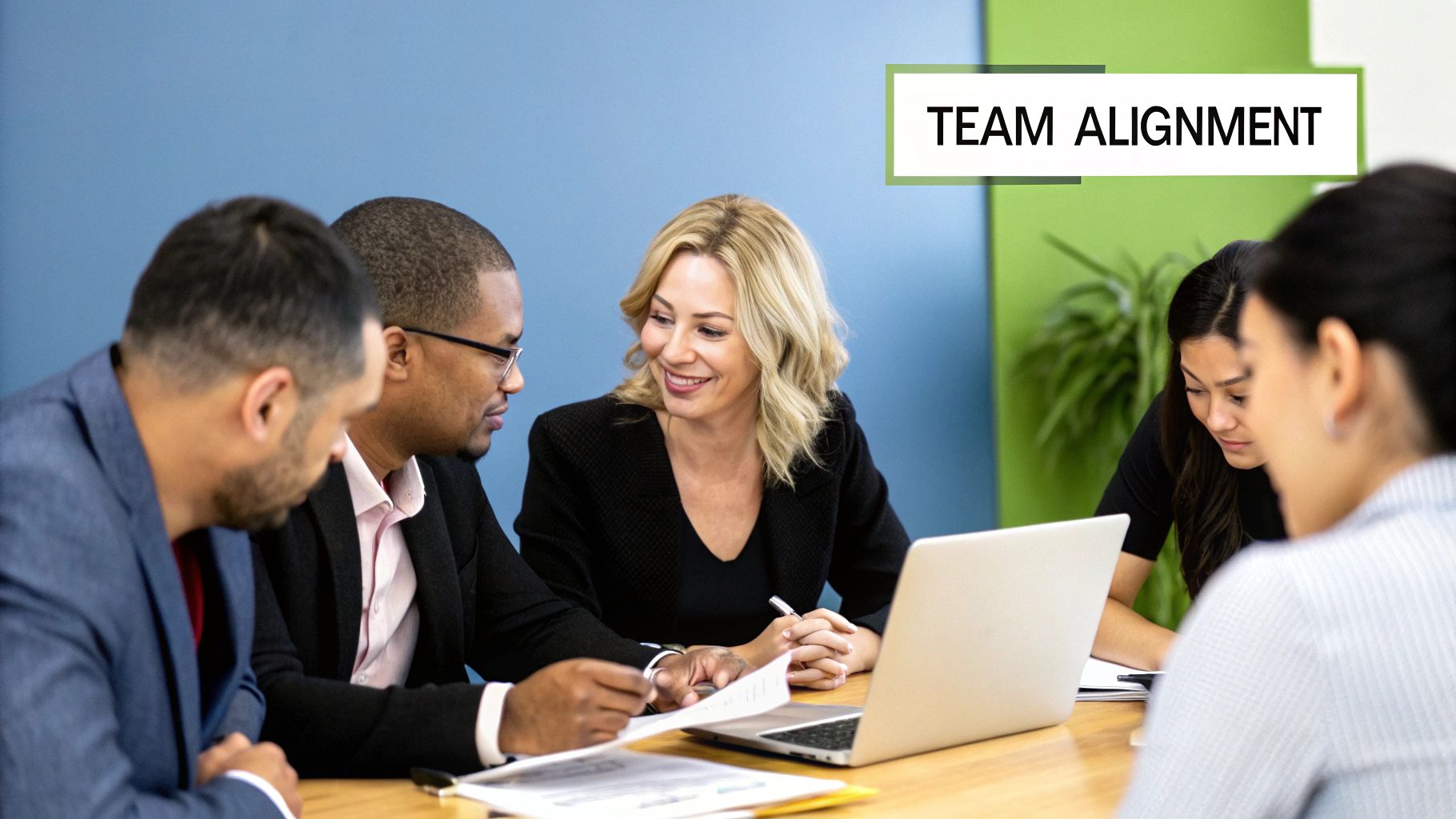 People in an office discussing work, representing team communication