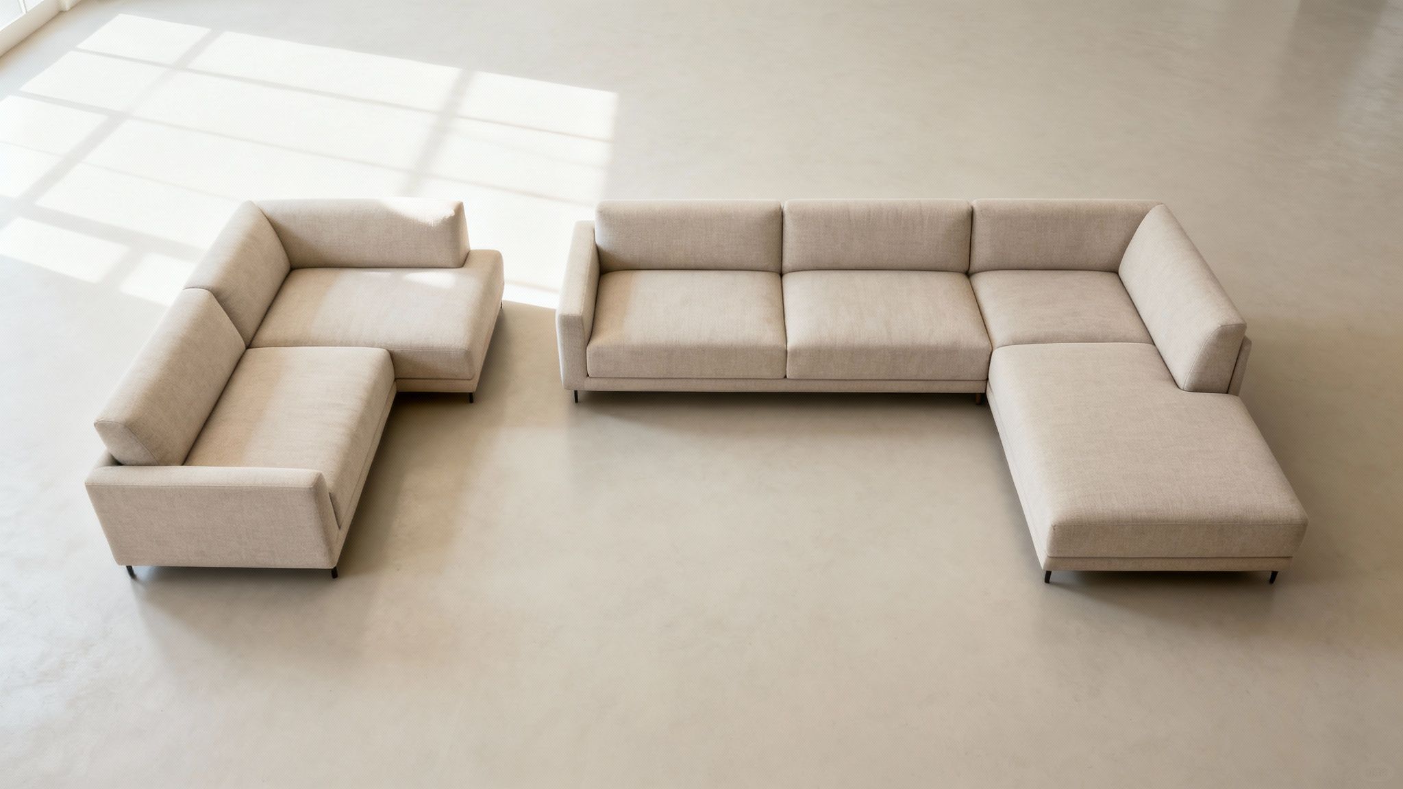 A person sitting on a comfortable modular sofa in a modern living room