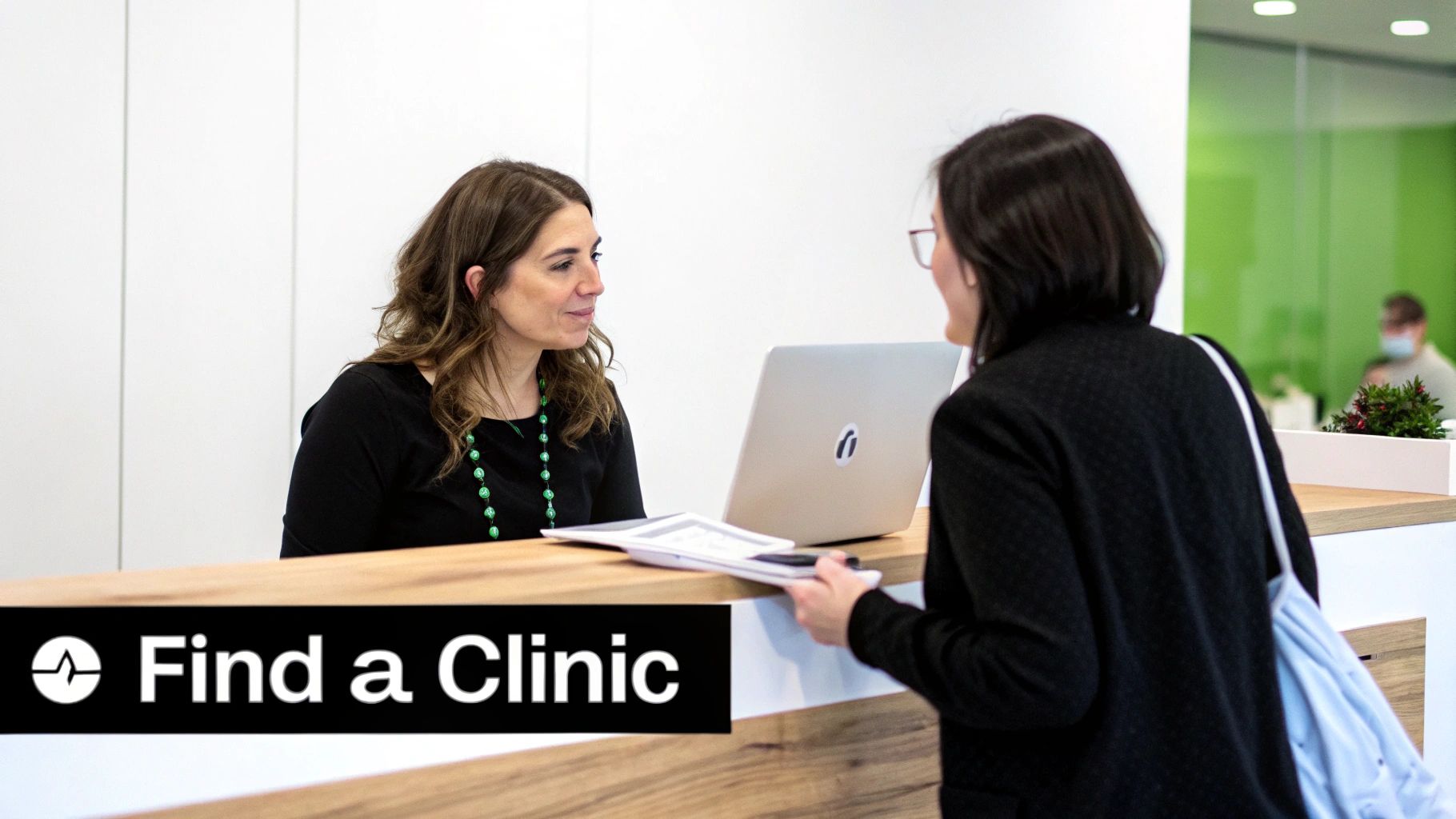 A checklist is being reviewed by a patient and a doctor.