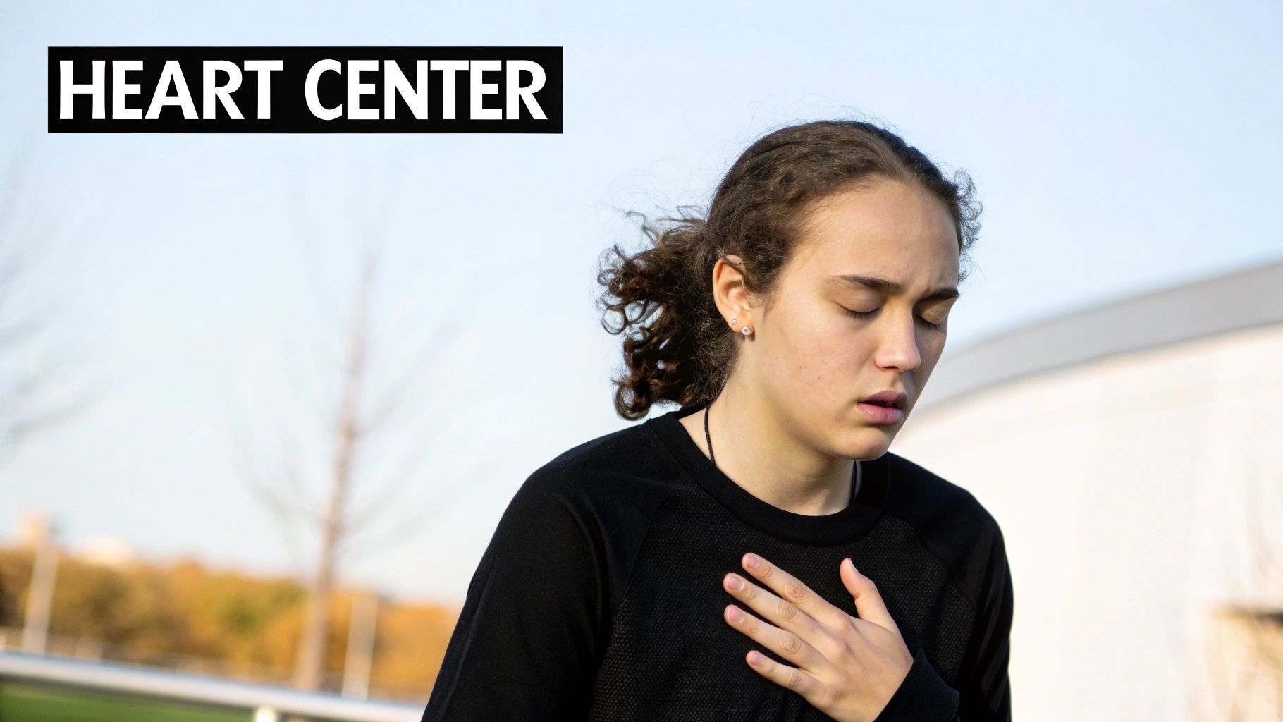 Young woman practicing heart center breathing technique for stress relief and mindfulness outdoors
