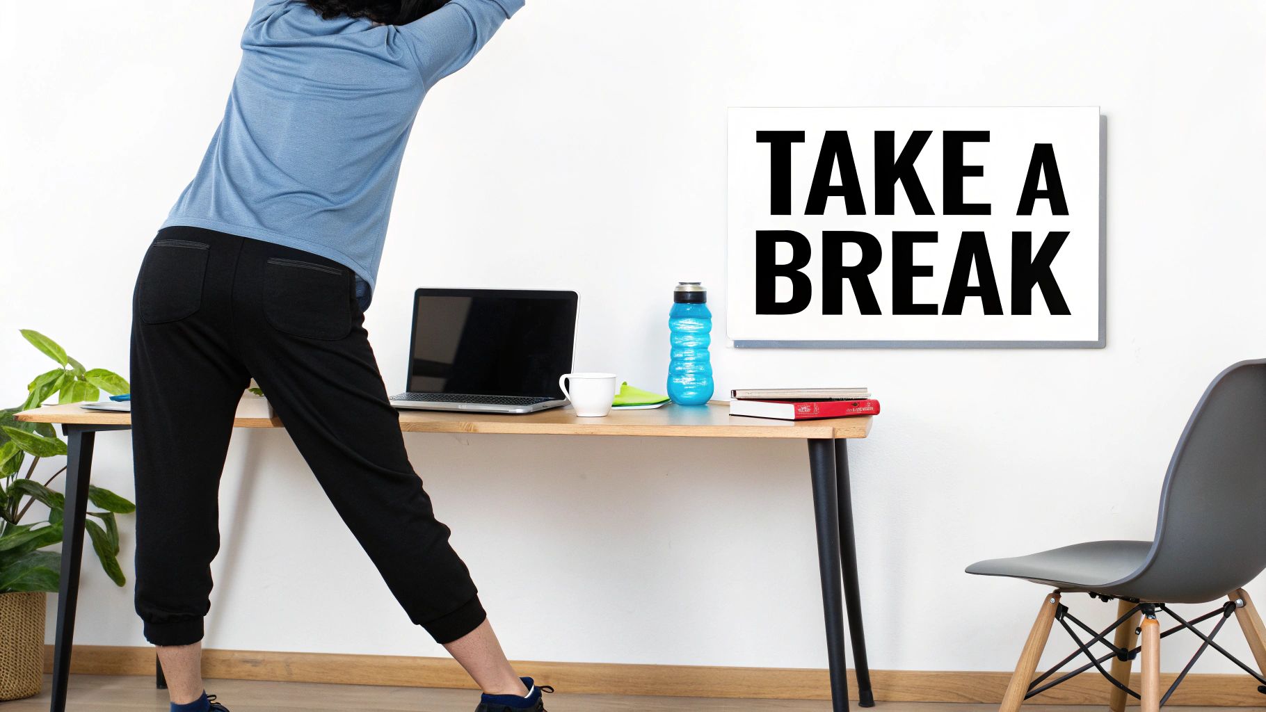 A person in a home office stretching, with a laptop and a "TAKE A BREAK" sign.