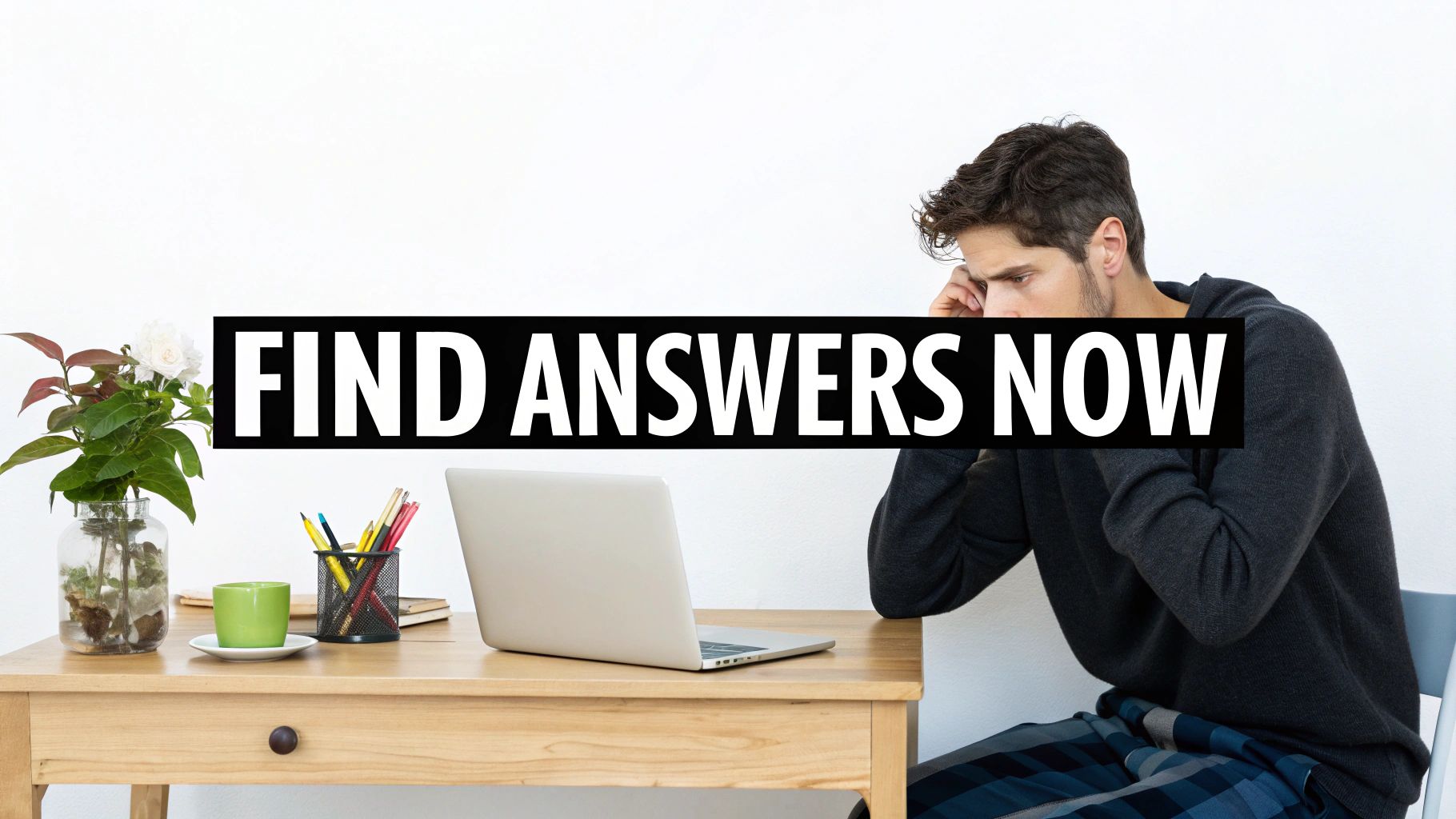 A man looking thoughtfully at his laptop on a desk, with text 'FIND ANSWERS NOW'.