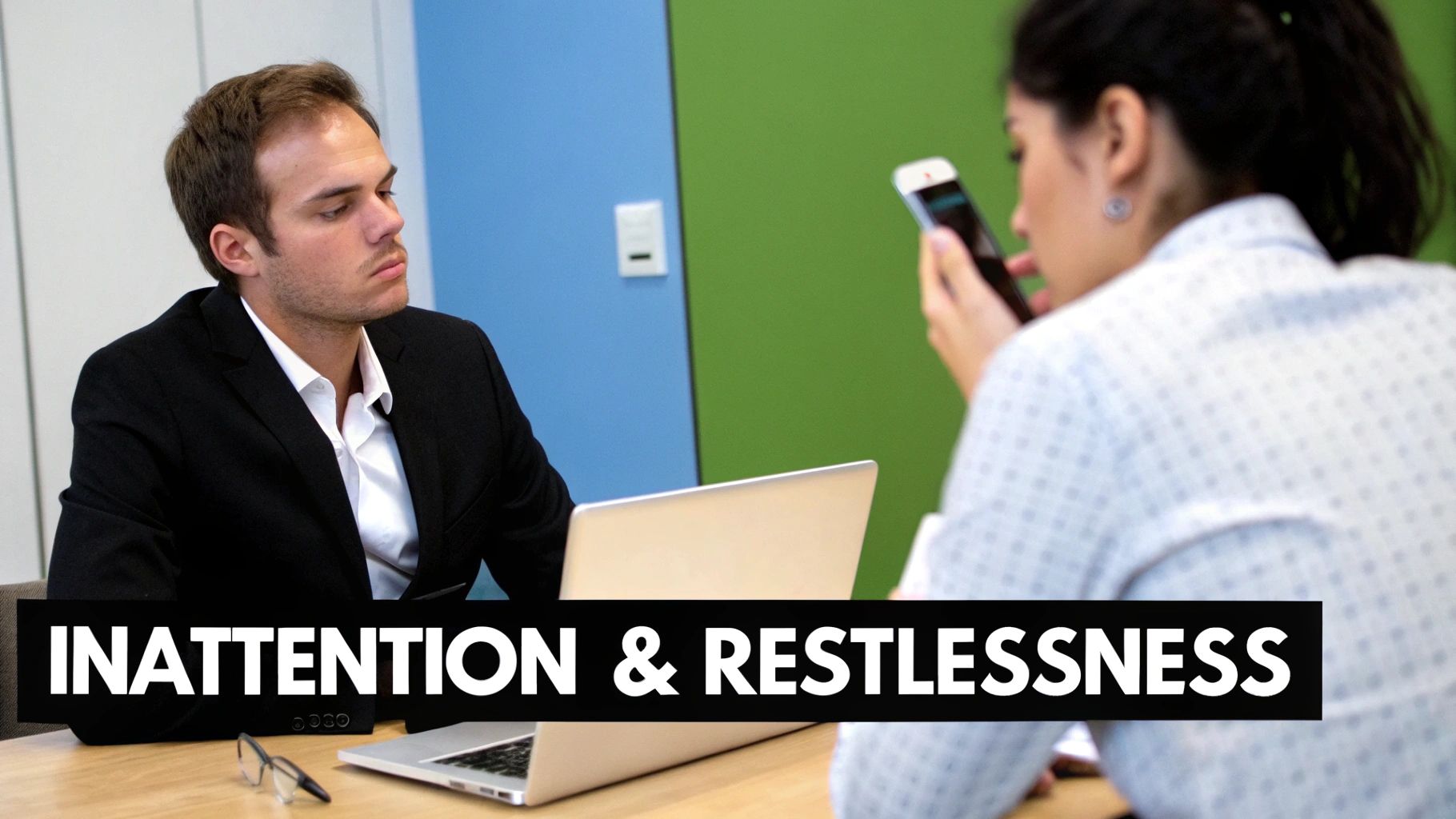A person sitting at a messy desk, looking overwhelmed by paperwork and distractions.