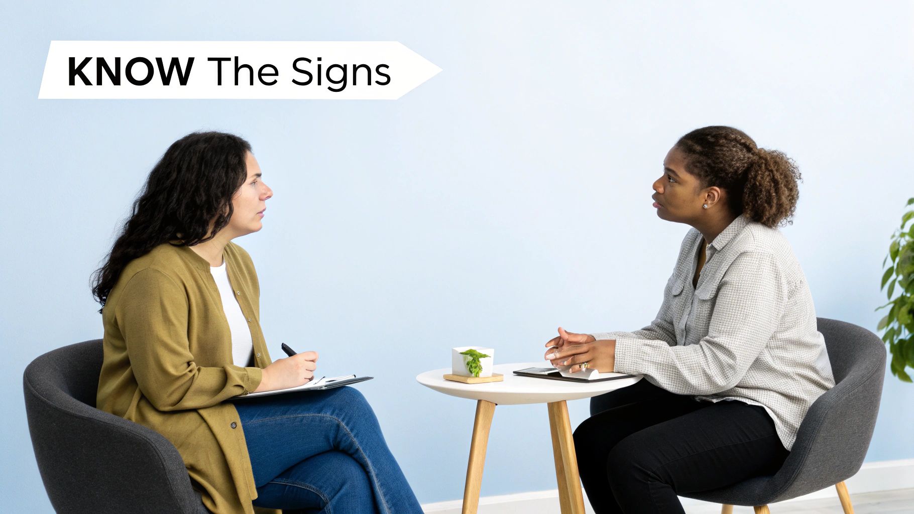 Two women in a consultation, one writing, with a "KNOW The Signs" overlay for awareness.