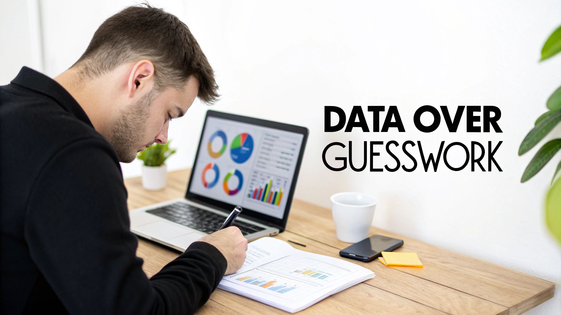 A man diligently analyzing business data on a laptop and physical reports, promoting data-driven decisions.