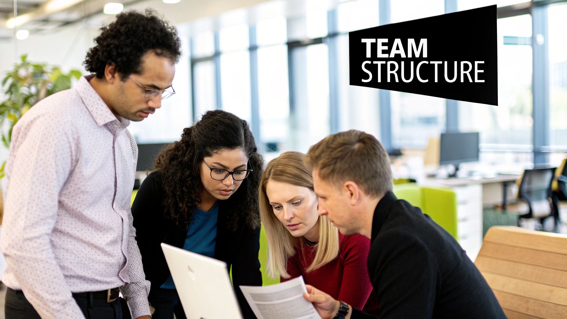 A diverse team of professionals collaborating around a whiteboard in a modern startup office, illustrating teamwork under pressure.