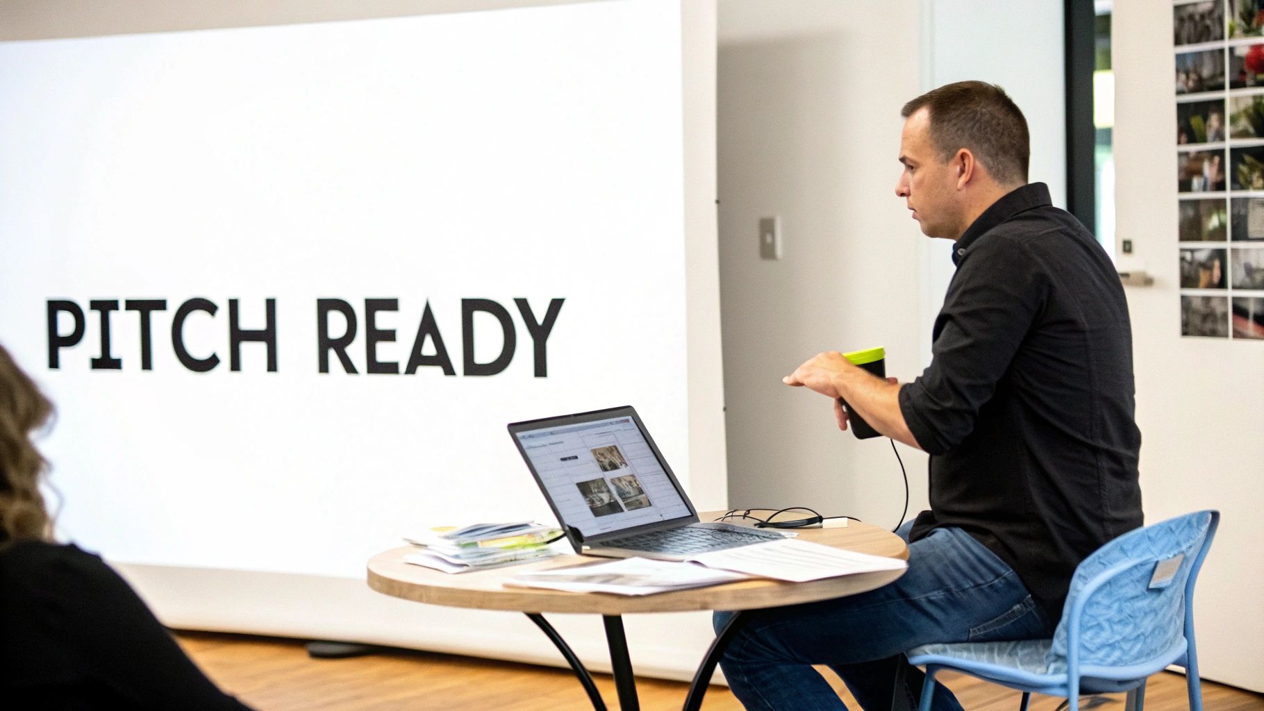 Man presenting in front of a "PITCH READY" sign, with a laptop and notes on a table, illustrating effective pitch preparation for startup fundraising.