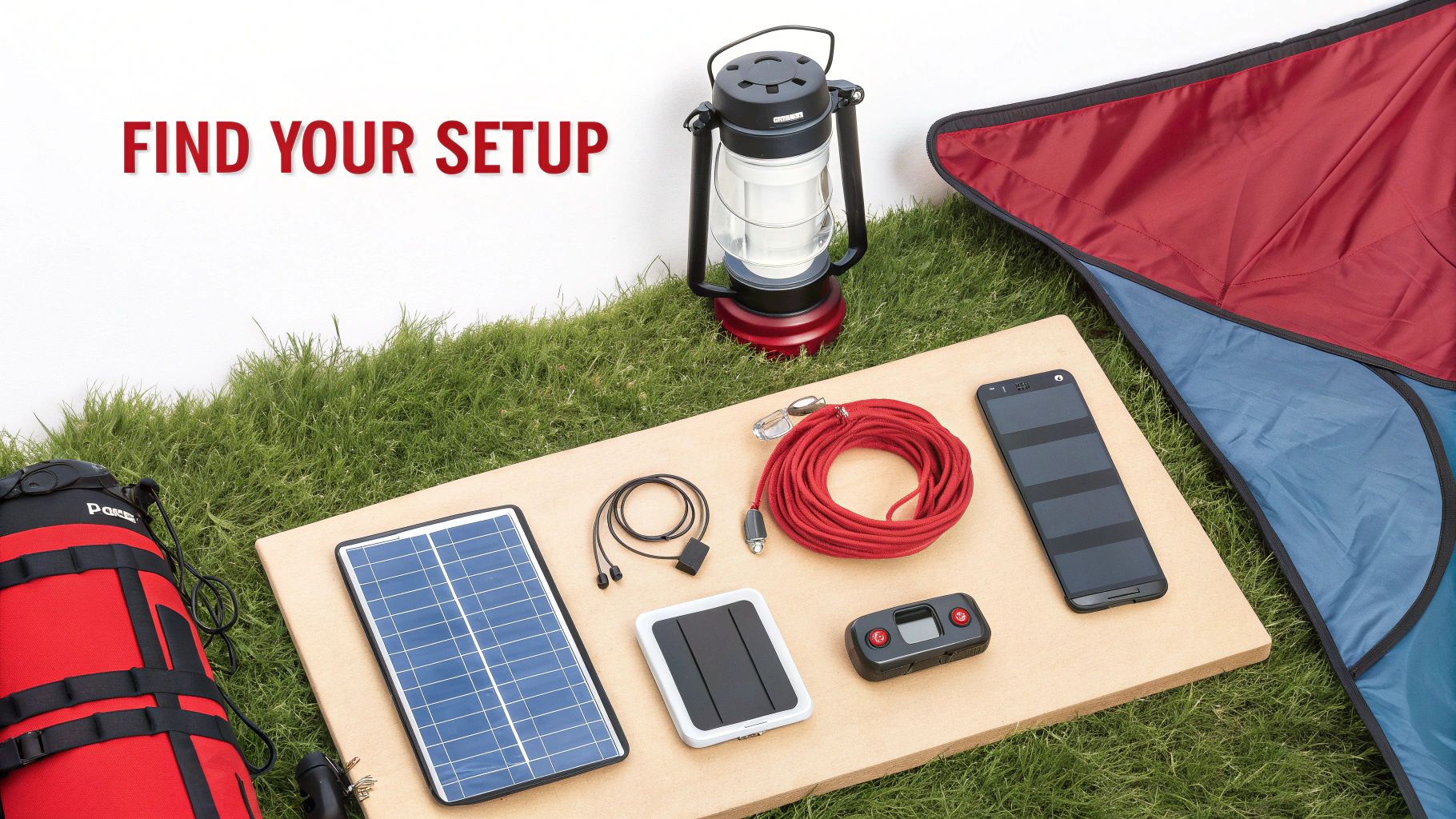 Various solar-powered camping and outdoor gear displayed on a wooden board on green grass.