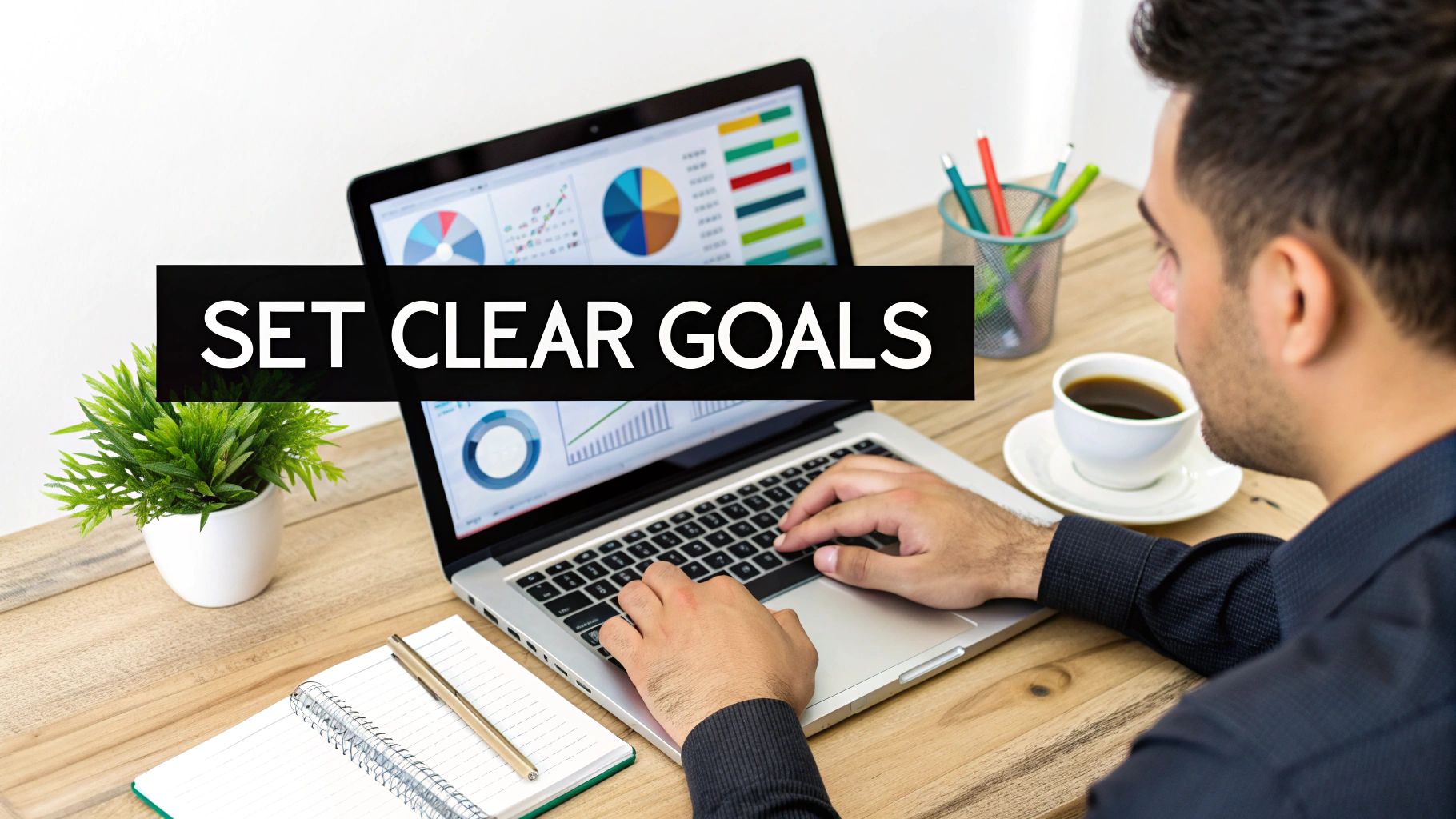 A person works on a laptop displaying business charts, with a 'SET CLEAR GOALS' text overlay.
