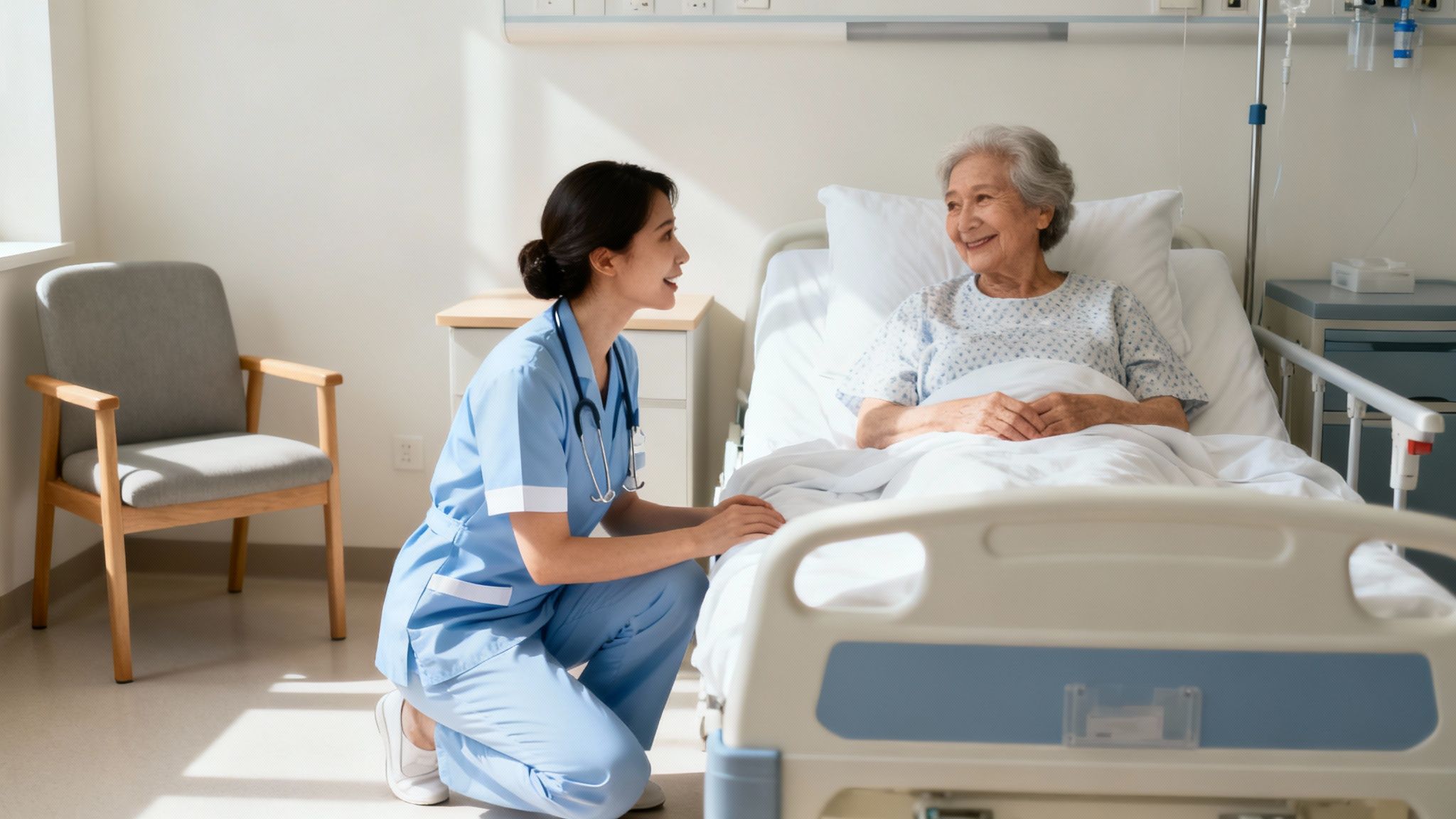 Healthcare nurse showing compassion while talking with elderly patient in hospital bed
