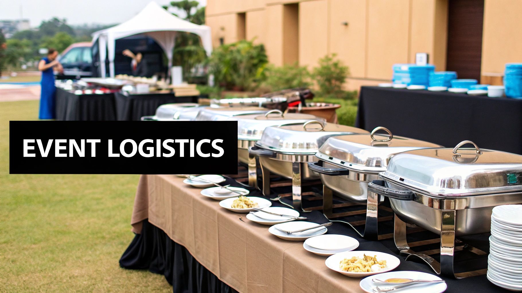 A well-organized catering setup at an event, showcasing chafing dishes and serving utensils.