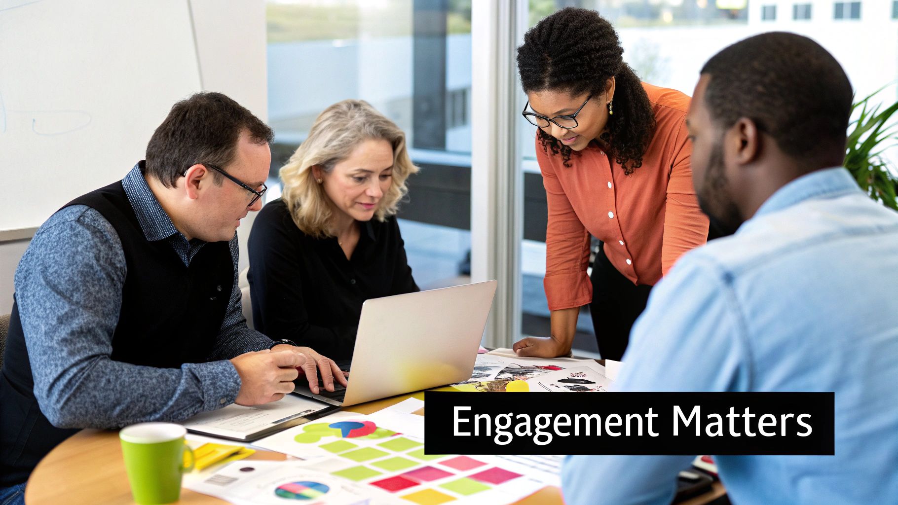 A diverse group of colleagues collaborating happily in a modern office space.