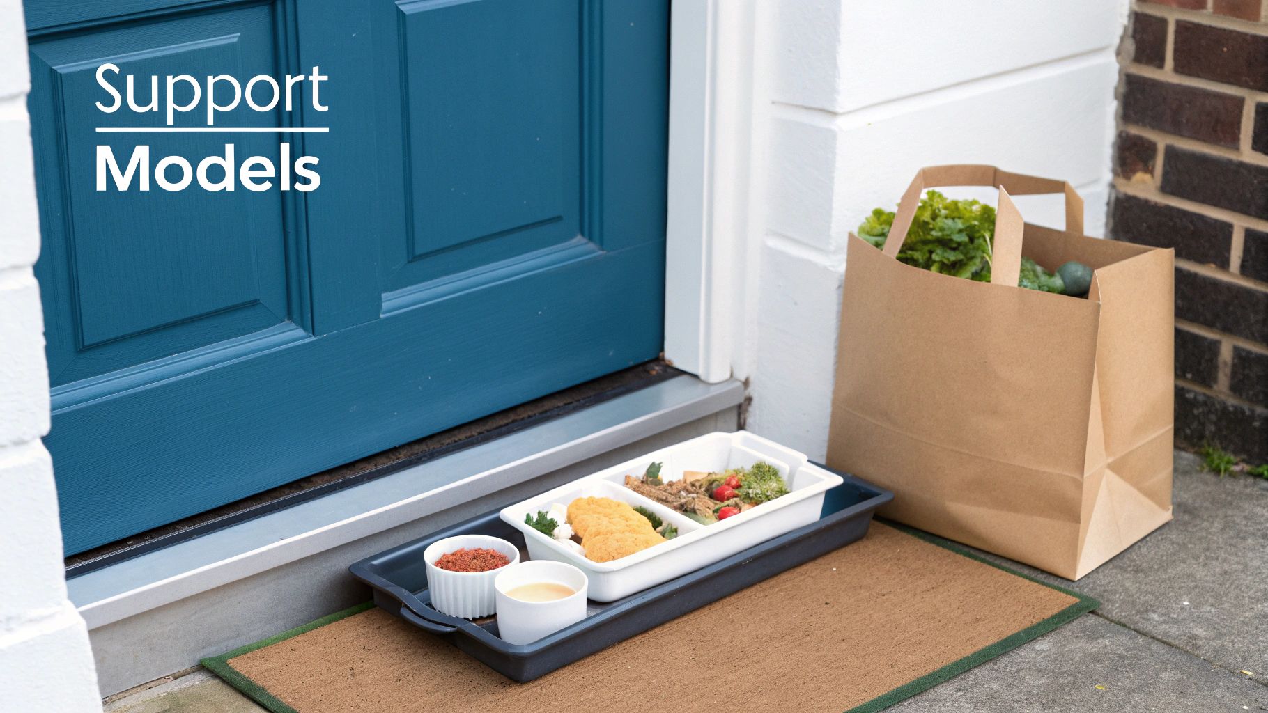 A healthy meal delivery tray and a grocery bag sit on a doormat at a front door.