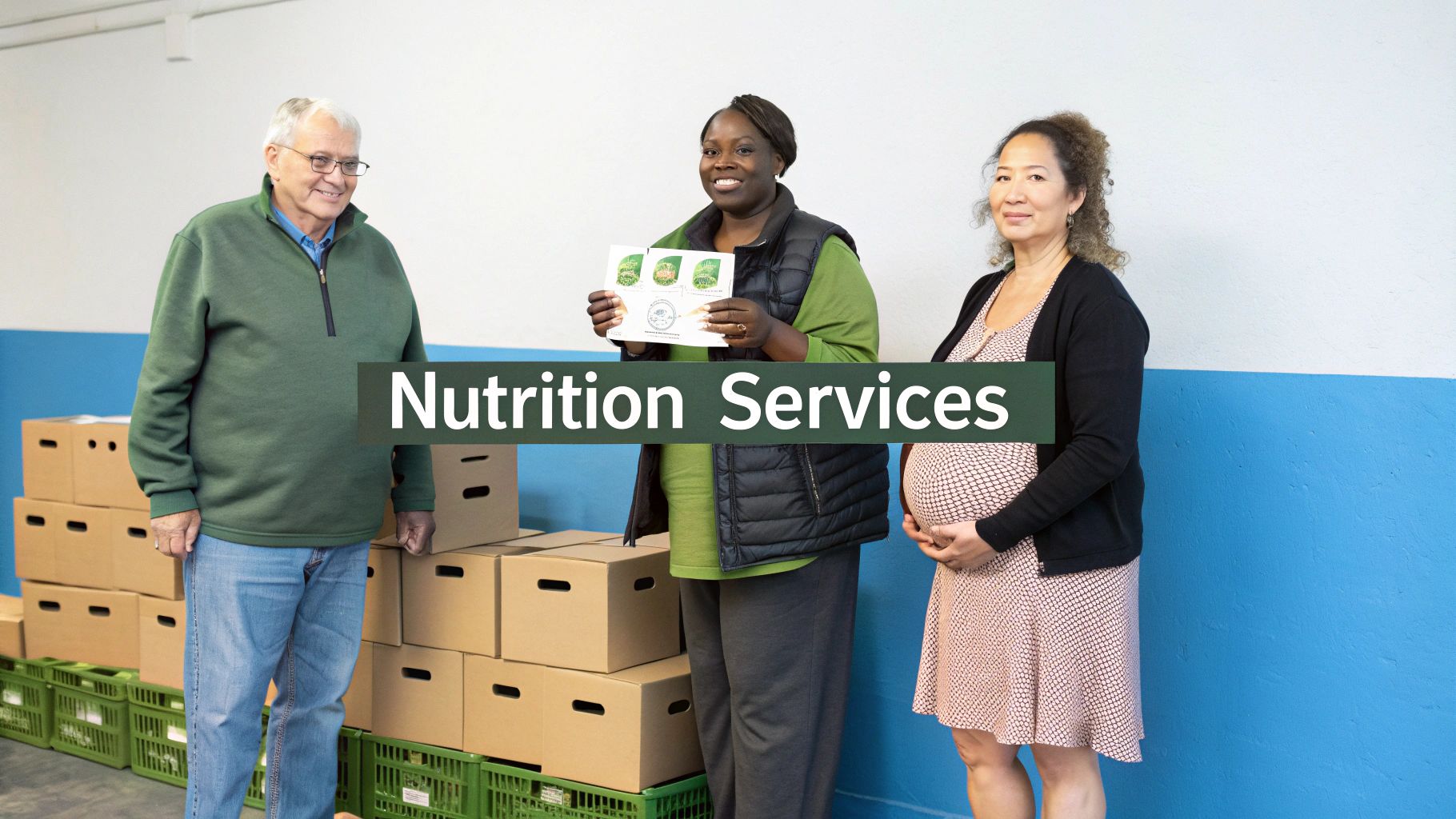 Three diverse people, including a pregnant woman, stand near stacks of food boxes for nutrition services.