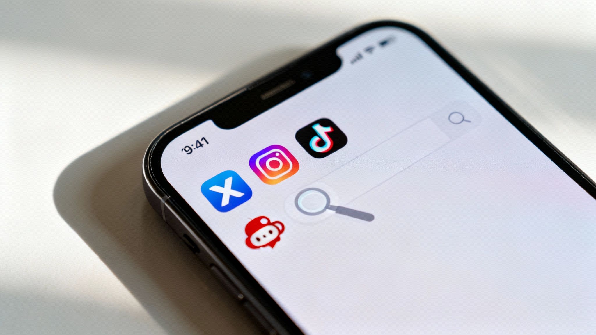 Social media icons on a smartphone screen, representing platforms where OnlyFans creators promote themselves.