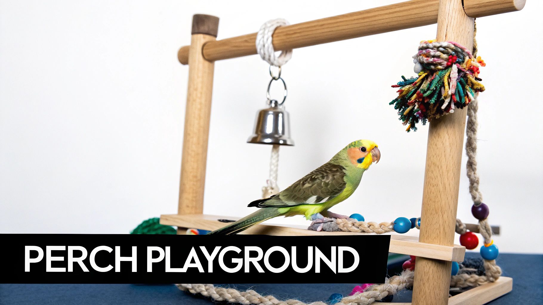 A small, colourful bird playing with toys on a wooden perch stand.