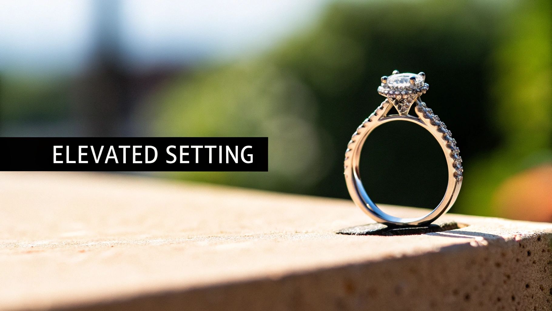 A sparkling diamond engagement ring with an elevated setting, standing on a stone surface.