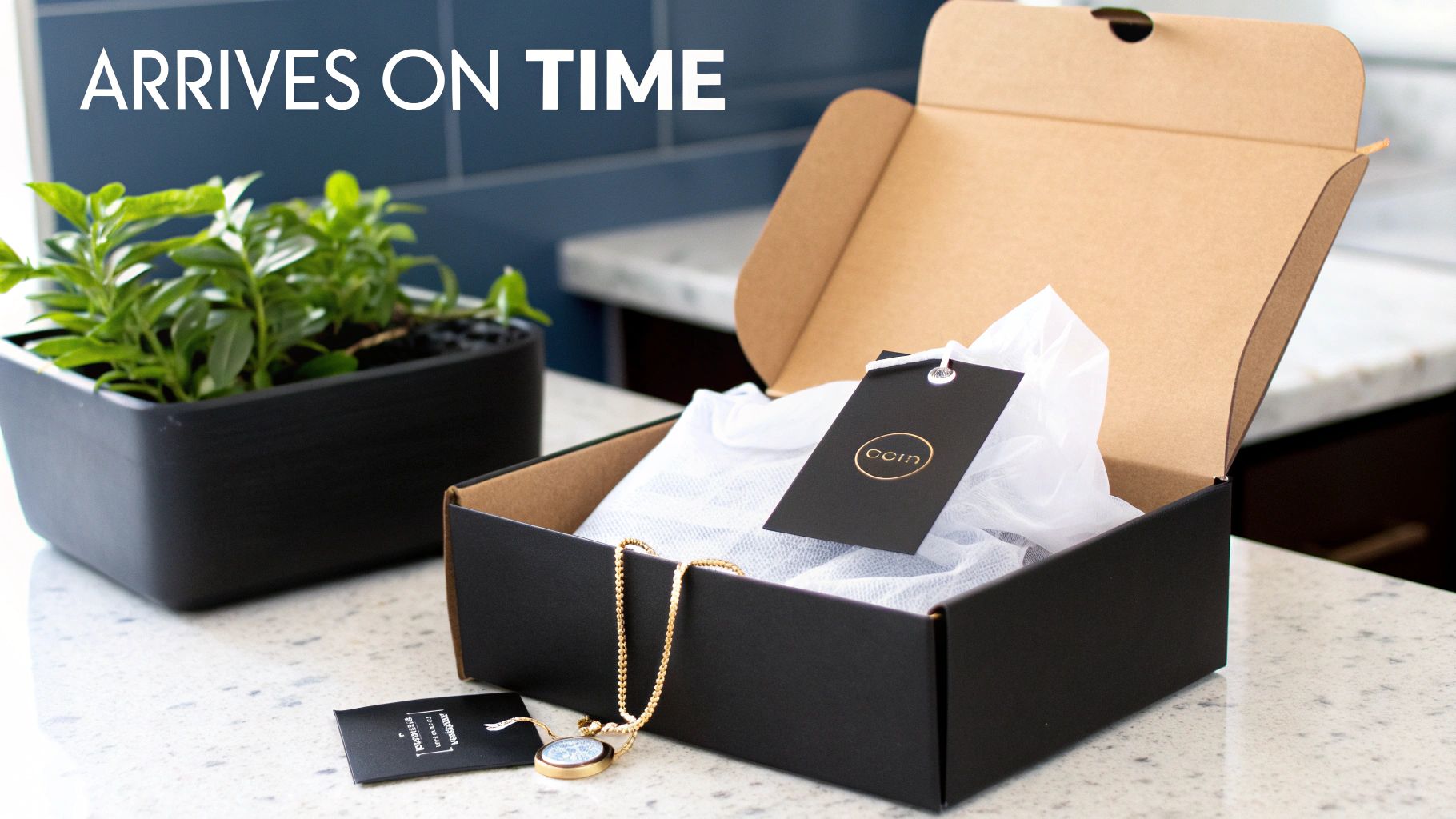 An open black gift box reveals a gold necklace and branded tag, implying timely gift arrival.
