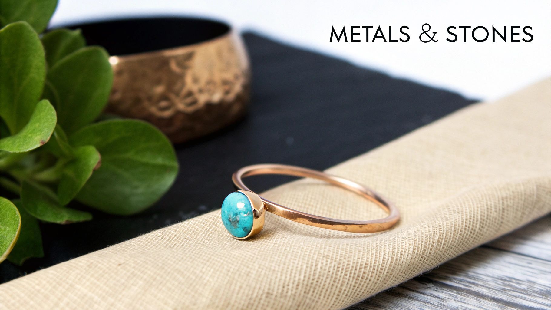 Close-up of a copper ring with a vibrant turquoise gemstone, resting on a textured beige fabric.