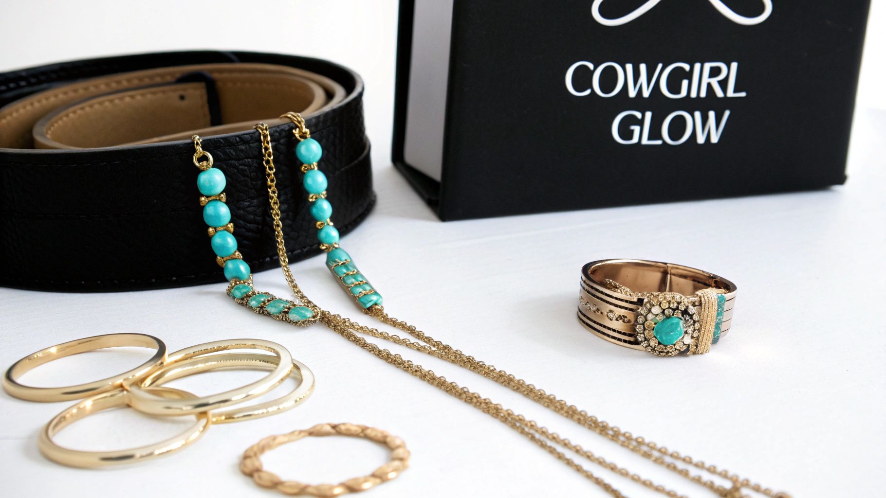 Turquoise and gold jewelry collection with necklace, rings, belt and Cowgirl Glow box