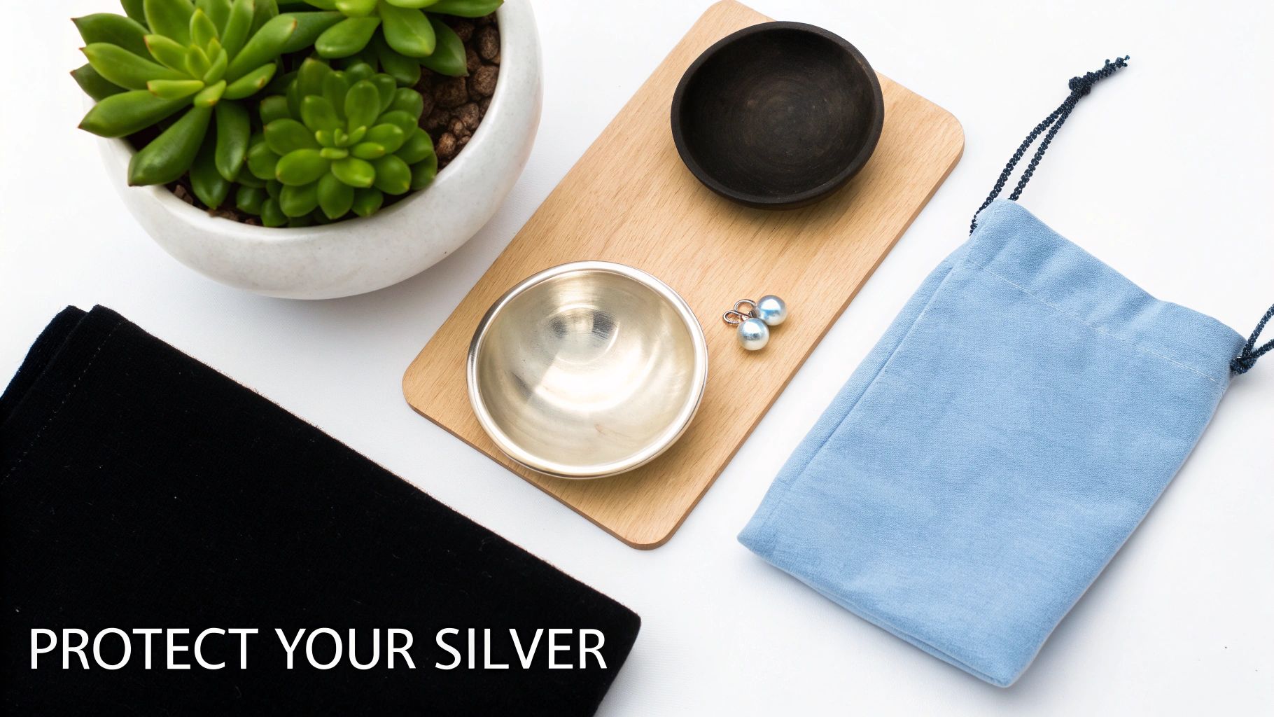 Various jewelry care items, including a silver bowl, pearl earrings, and protective bags, emphasize silver protection.