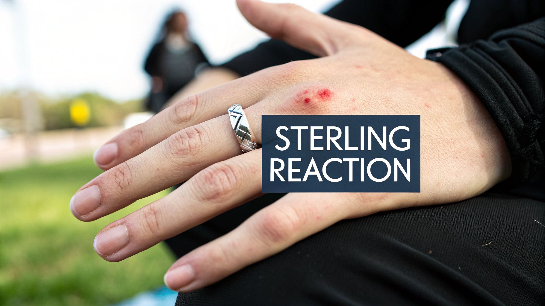 A person wearing several Southwestern-style sterling silver rings and bracelets