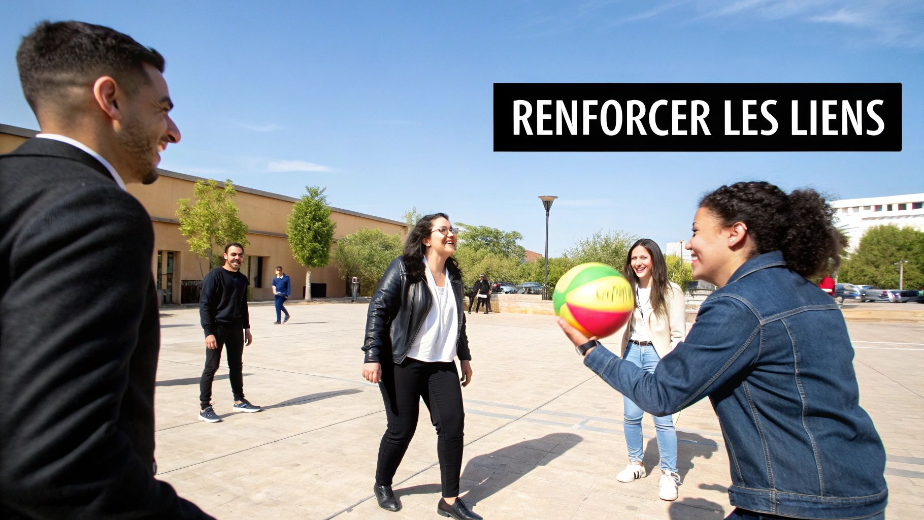 Young smiling people playing ball outside, strengthening their social bonds.