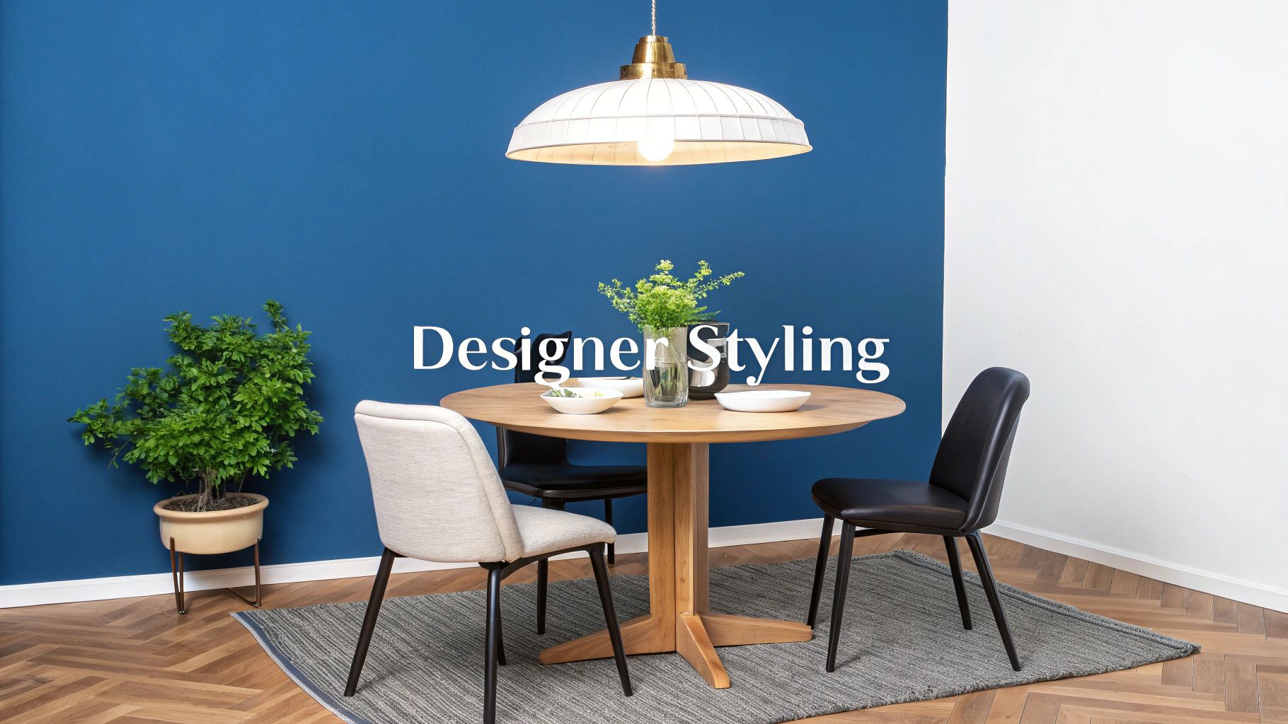 A beautifully styled round dining table with pendant lighting above it, creating a warm and inviting atmosphere.