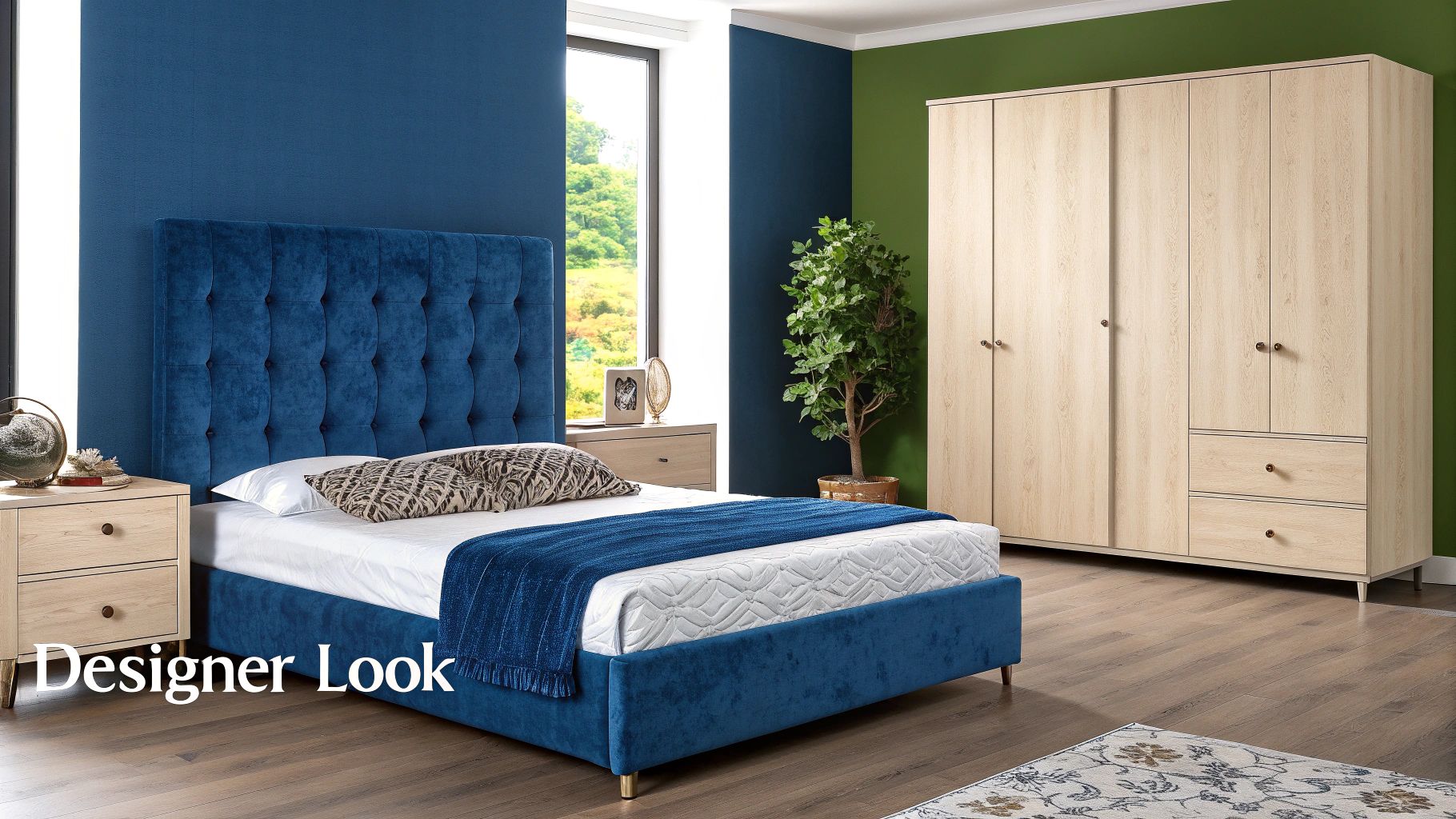 A modern bedroom featuring a royal blue tufted bed, wooden furniture, and a green accent wall.