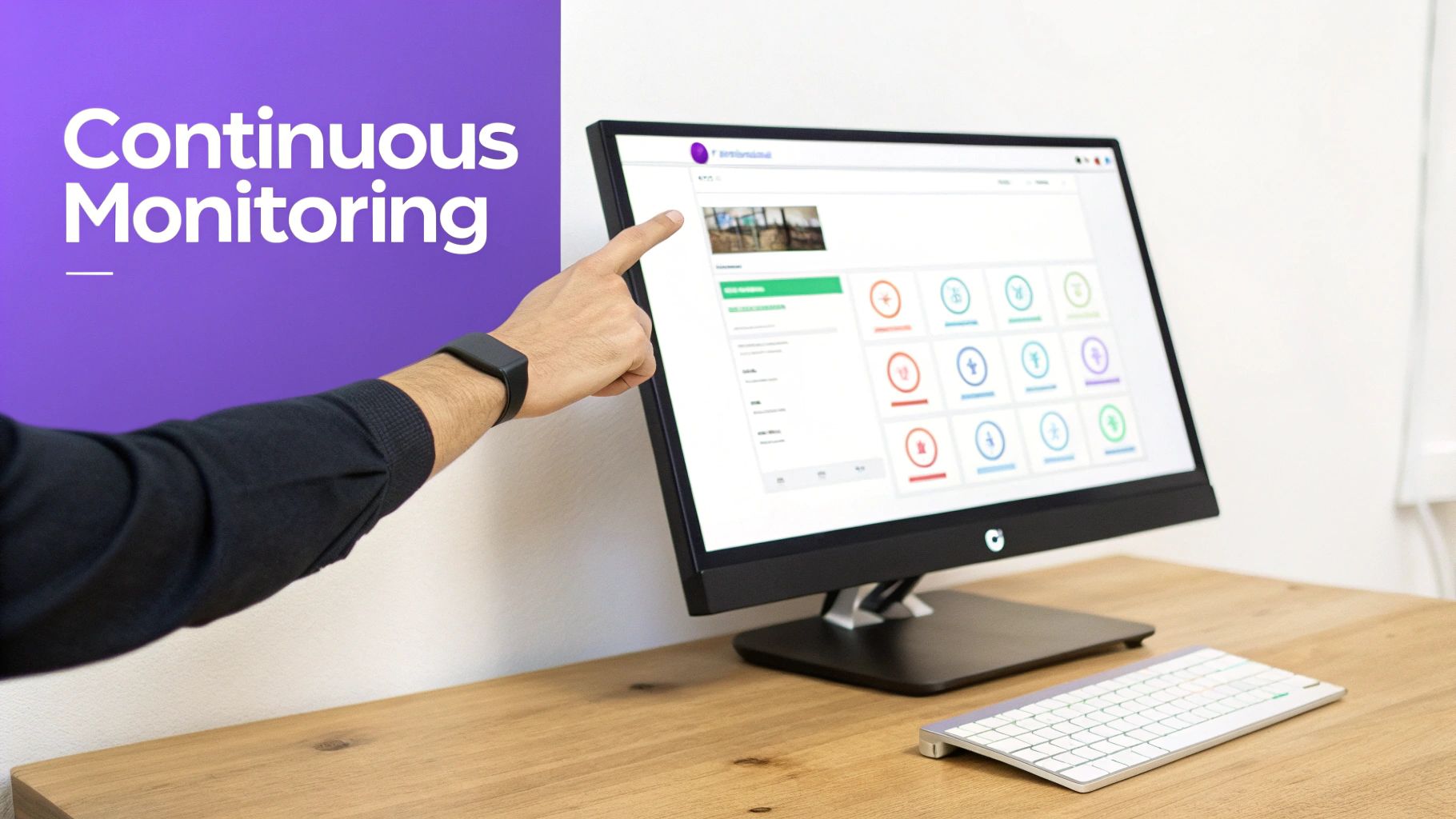 Hand pointing at a computer monitor displaying a continuous monitoring dashboard for regulatory compliance.