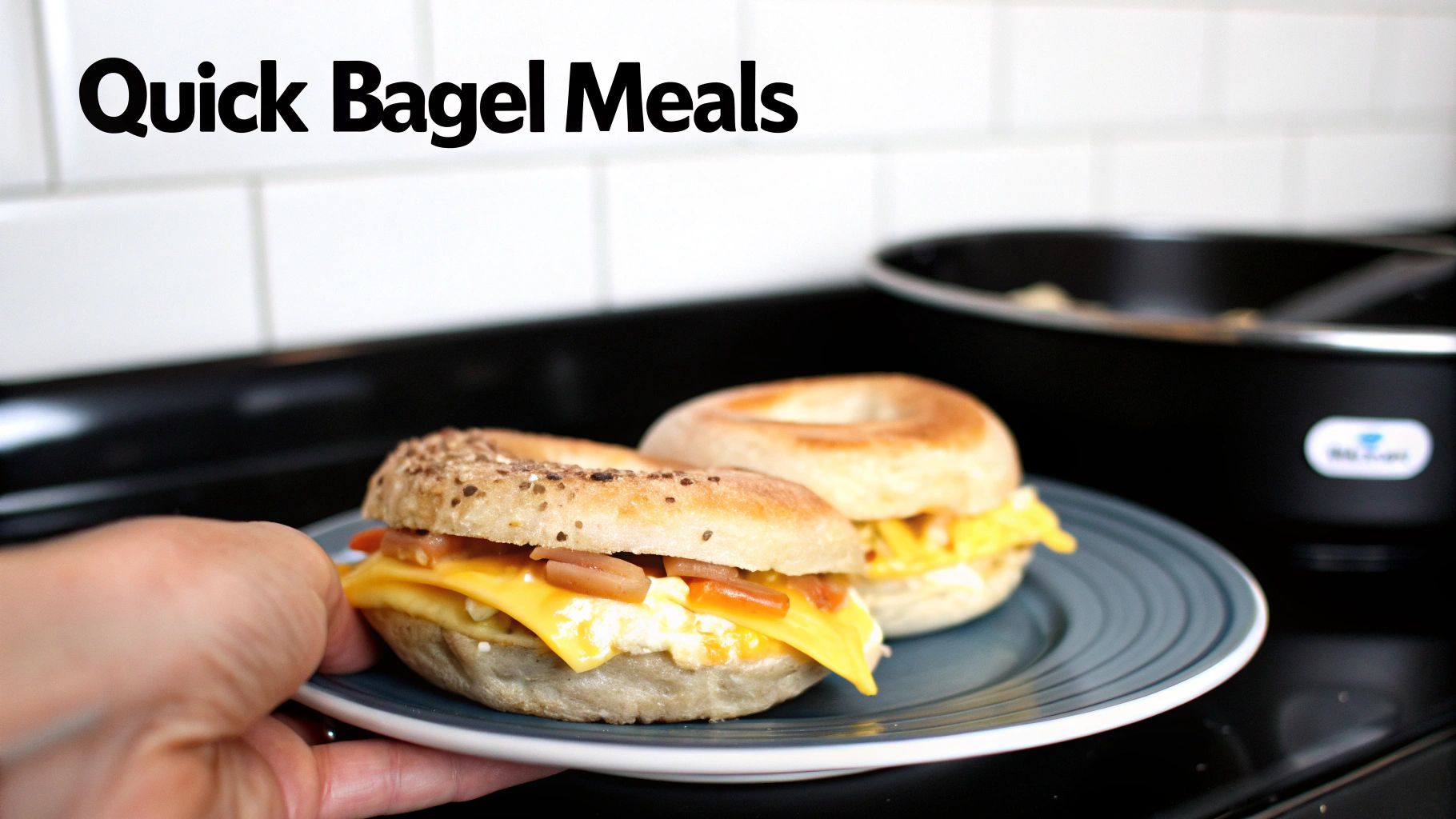 Two breakfast bagel sandwiches with eggs, cheese, and bacon on a black plate