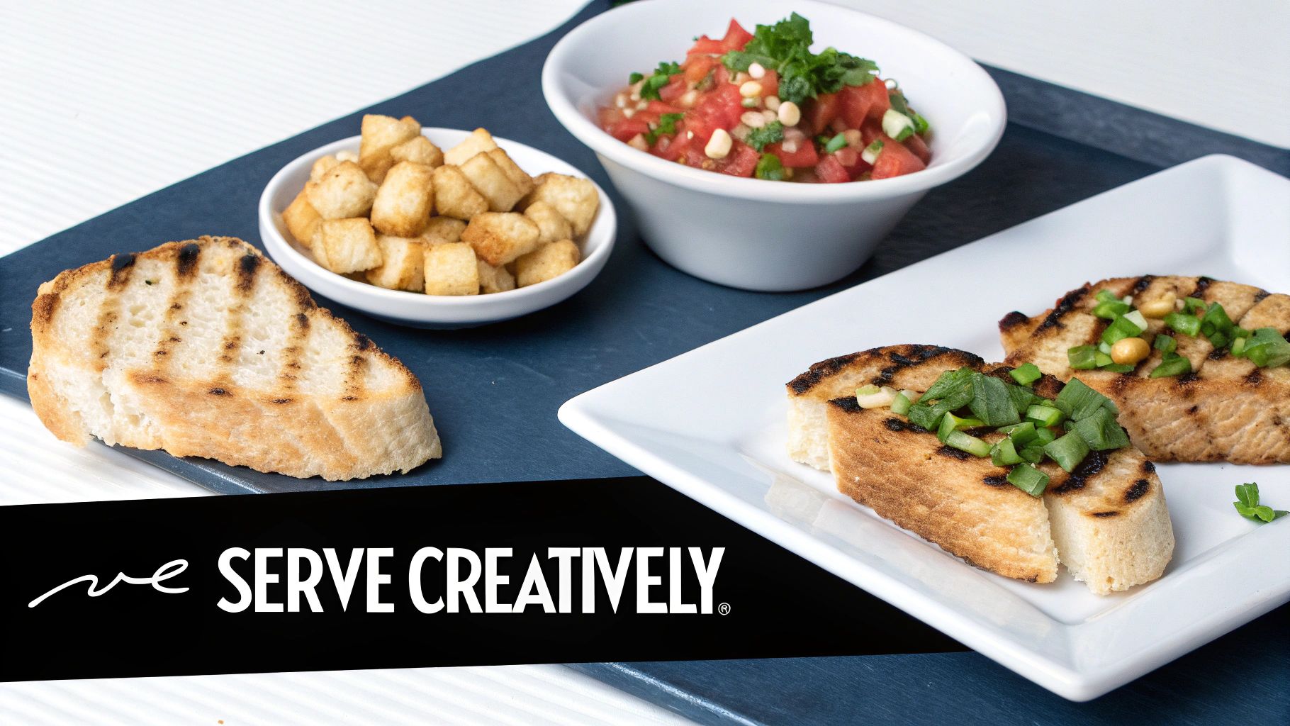A spread of grilled Texas toast slices, a bowl of tomato salsa, and crispy croutons.