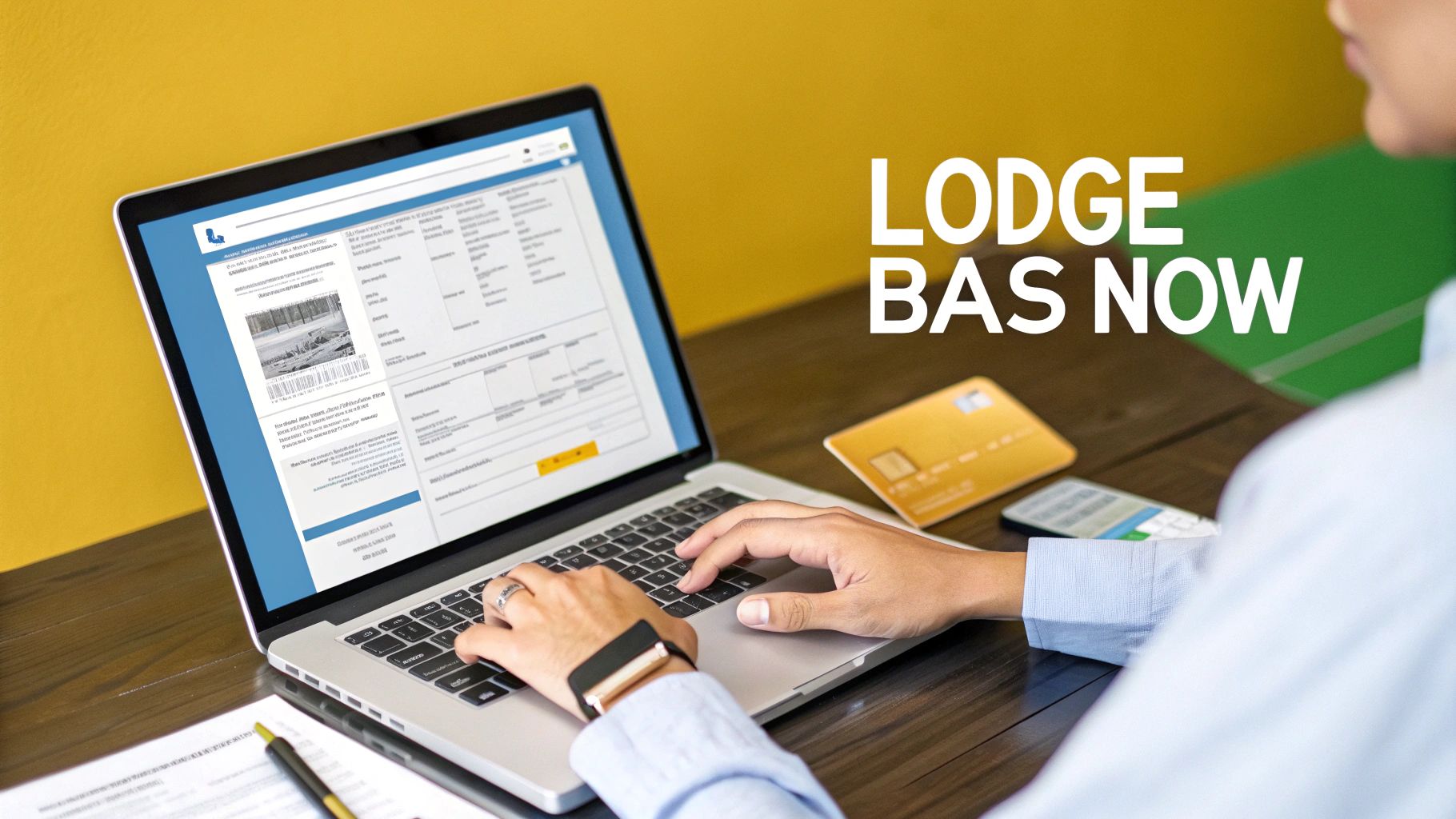 A close-up shot of a person using a laptop to lodge their BAS, with the ATO website visible on the screen.