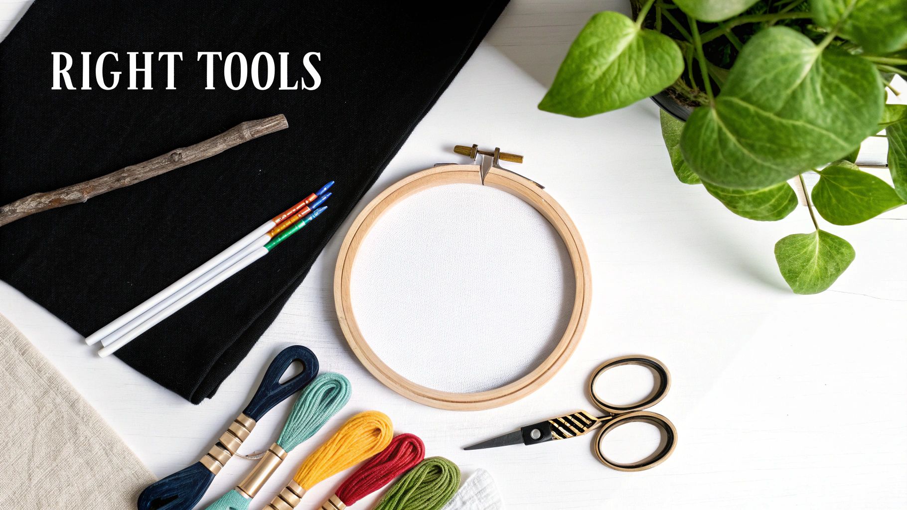 A collection of cross-stitching tools including embroidery floss, a tapestry needle, and an embroidery hoop.